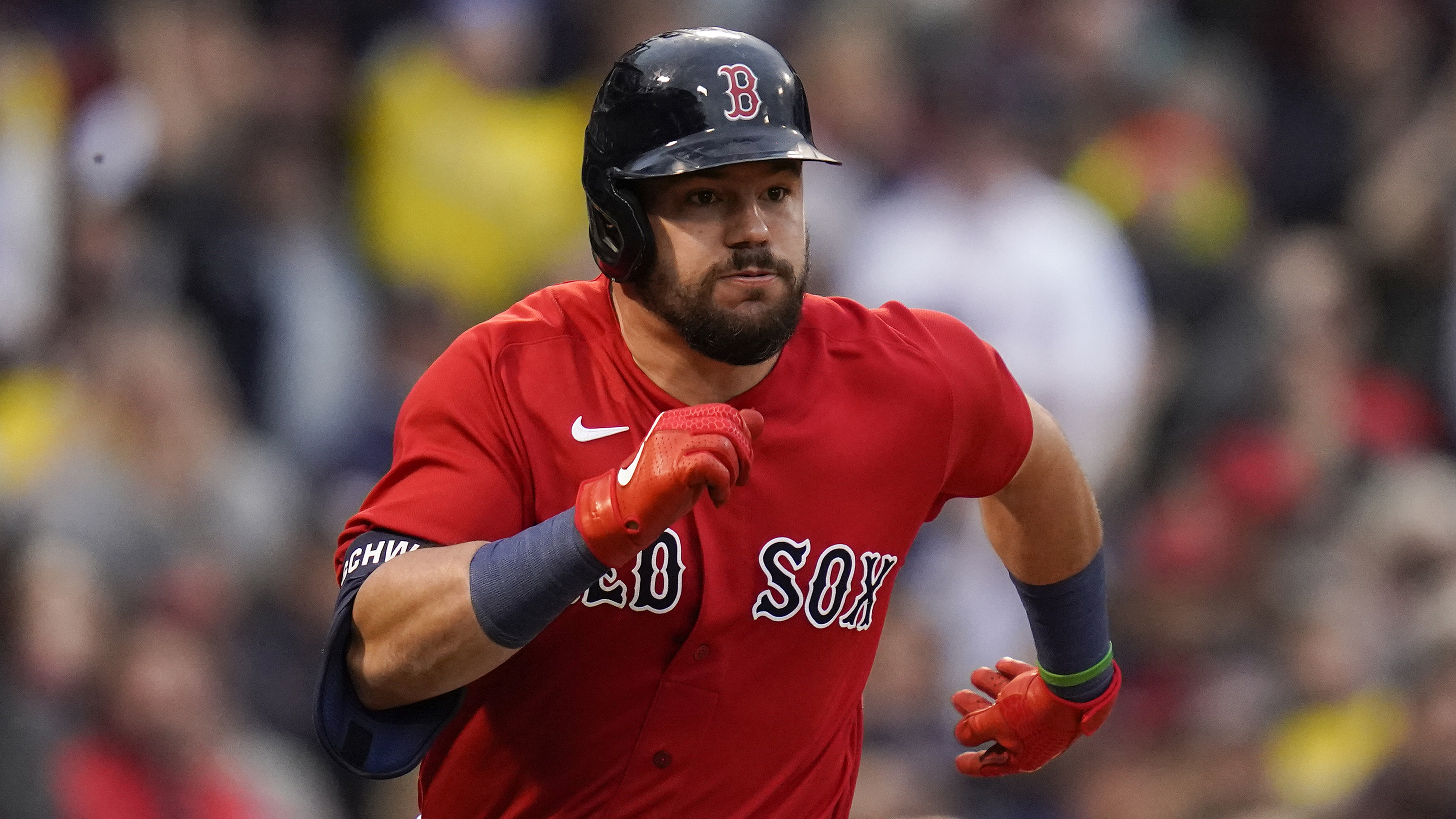 FILE - Boston Red Sox' Kyle Schwarber runs up the first baseline on a single against the Tampa Bay Rays during the third inning during Game 3 of a baseball American League Division Series, Sunday, Oct. 10, 2021, in Boston. Kyle Schwarber is coming to Philadelphia, agreeing Wednesday, March 16, 2022, to a four-year deal with the Phillies worth about $80 million, a person familiar with the negotiations told The Associated Press.