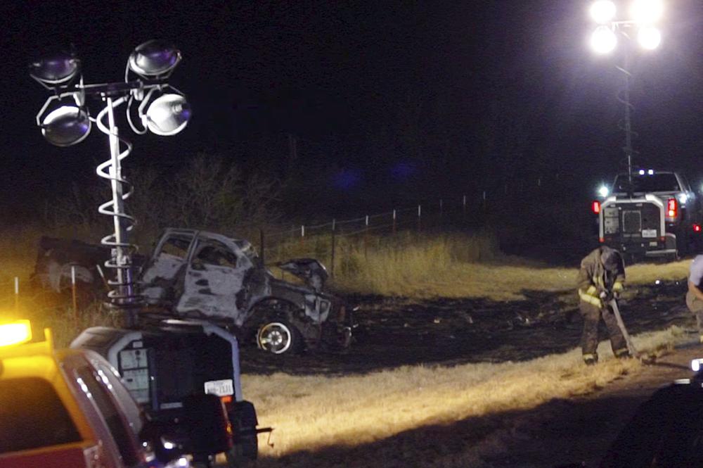 Emergency responders work the scene of a fatal crash late Tuesday in Andrews County, Texas. A vehicle carrying members of the University of the Southwest's golf teams collided head-on with a pickup truck in West Texas, killing multiple people, authorities said.