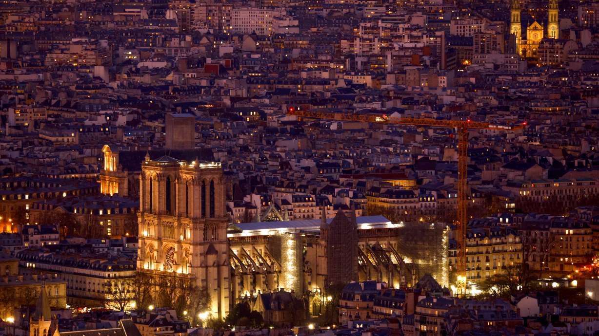 A view shows a giant crane near the Notre-Dame de Paris Cathedral as work continues to rebuild the roof and the spire destroyed by fire, in Paris, France, Feb. 9. Archaeologists have found an ancient lead sarcophagus under the Notre Dame cathedral, offering a new insight into the history of the building.