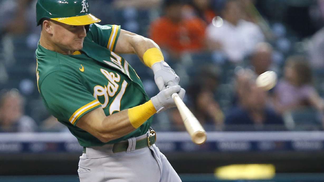FILE -O akland Athletics' Matt Chapman hits a two-run home run against the Detroit Tigers during the third inning of a baseball game Tuesday, Aug. 31, 2021, in Detroit. All-Star third baseman Matt Chapman was acquired by the Toronto Blue Jays from the payroll-shredding Oakland Athletics for four players on Wednesday, March 16, 2022.