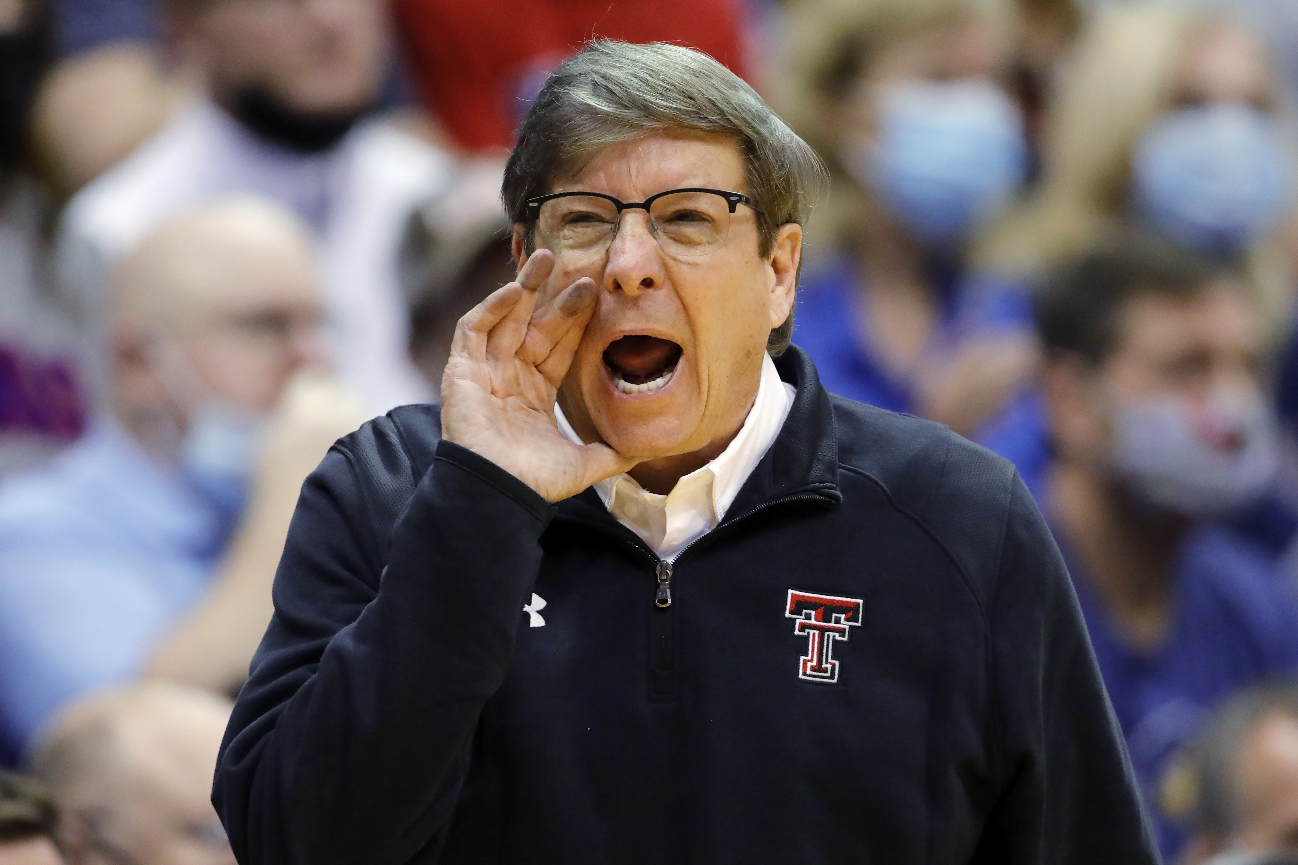 FILE - Texas Tech head coach Mark Adams communicates with his players during the second half of an NCAA college basketball game against Kansas on Monday, Jan. 24, 2022, in Lawrence, Kan. First-year Texas Tech head coach Mark Adams was picked as The Associated Press coach of the year in the Big 12 in a close vote, announced Tuesday, March 8, 2022. 