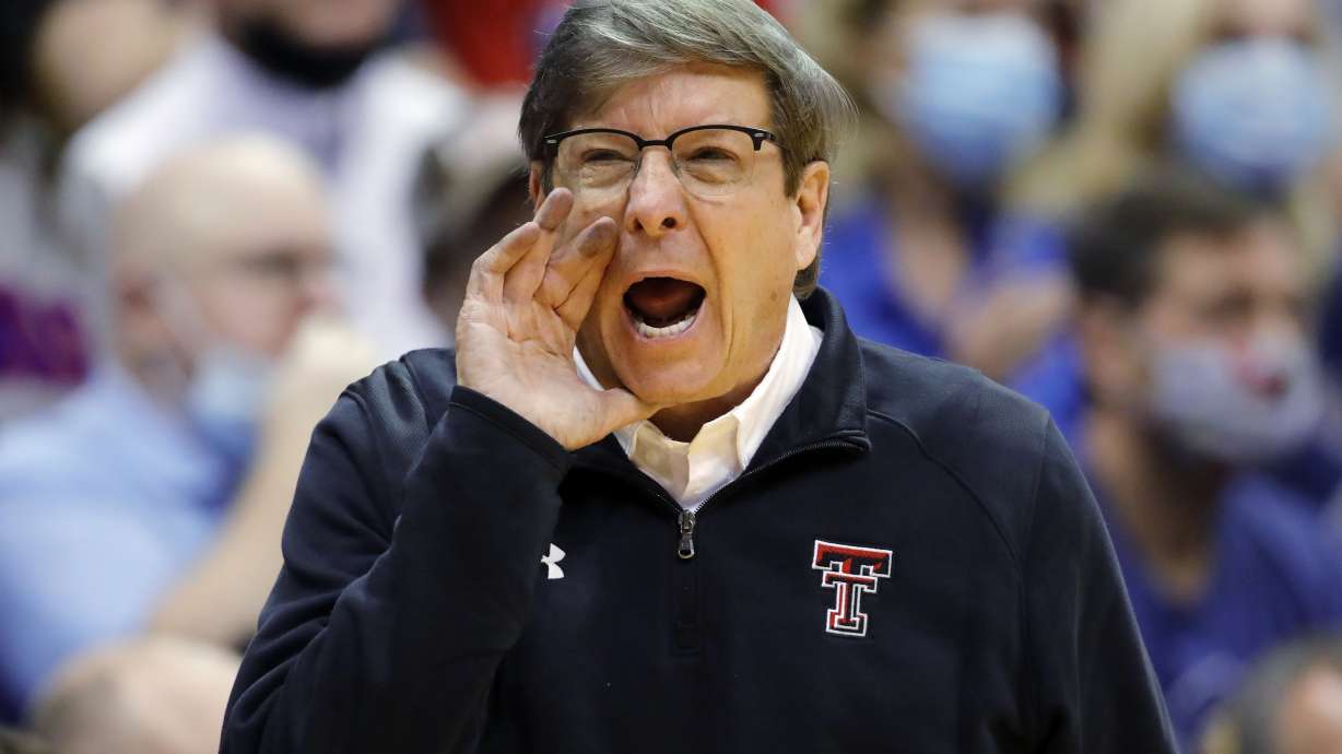 FILE - Texas Tech head coach Mark Adams communicates with his players during the second half of an NCAA college basketball game against Kansas on Monday, Jan. 24, 2022, in Lawrence, Kan. First-year Texas Tech head coach Mark Adams was picked as The Associated Press coach of the year in the Big 12 in a close vote, announced Tuesday, March 8, 2022.