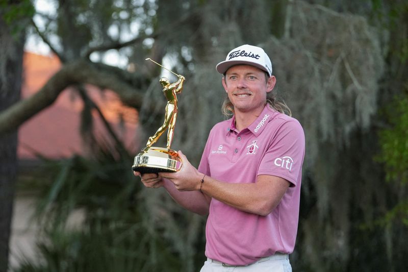FILE PHOTO: Cameron Smith displays the champions trophy after winning The Players Championship golf tournament at TPC Sawgrass, Ponte Vedra Beach, Florida, USA, March 14, 2022. David Yeazell-USA TODAY Sports