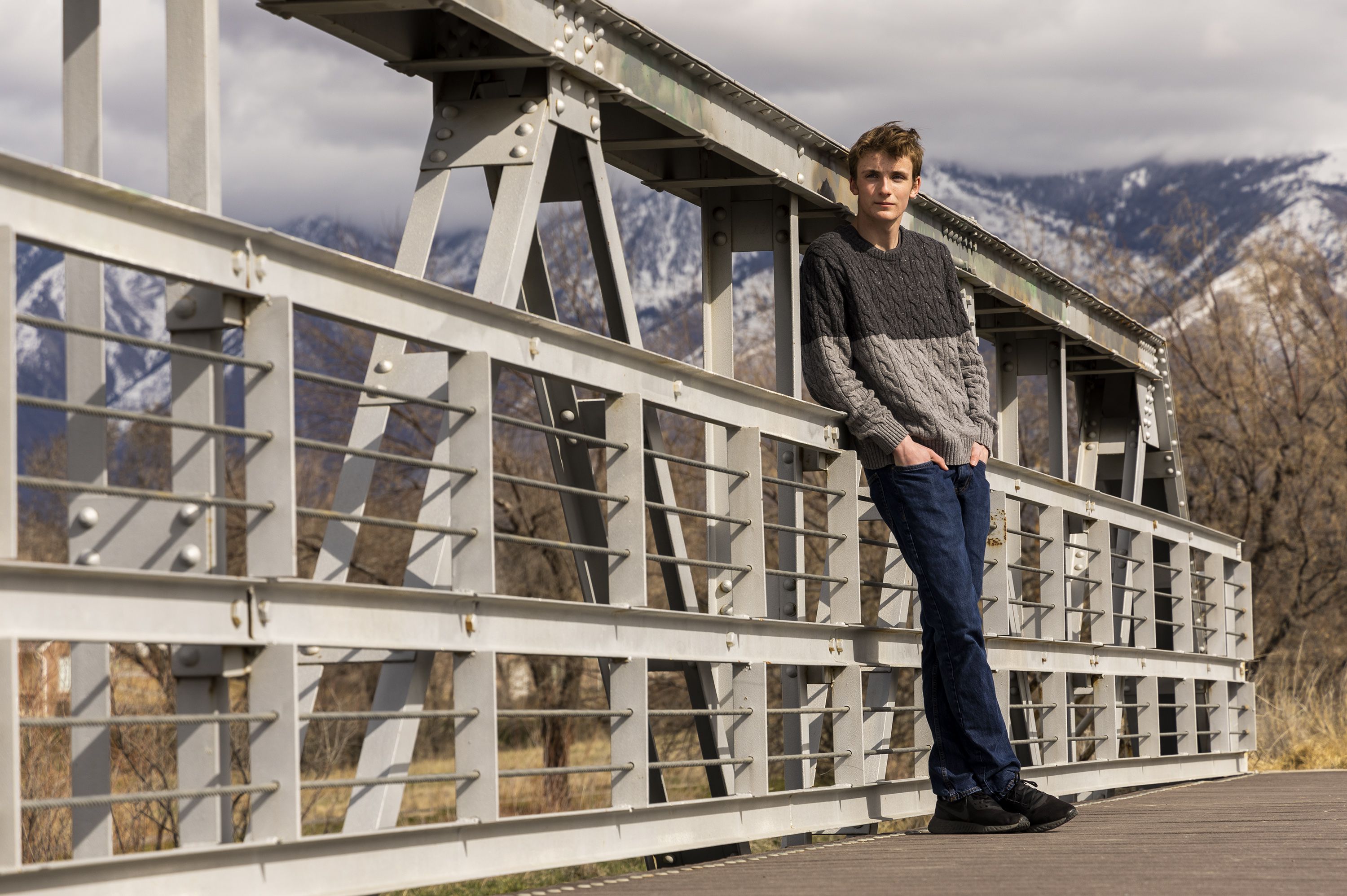 Dallin Rima, a 17-year-old senior at Hillcrest High School, poses for photos in Riverton, Utah, on Wednesday. Rima is one of seven young people in Utah that filed a new constitutional climate lawsuit against the state government, asserting that Utah is actively causing and contributing to the climate crisis.
