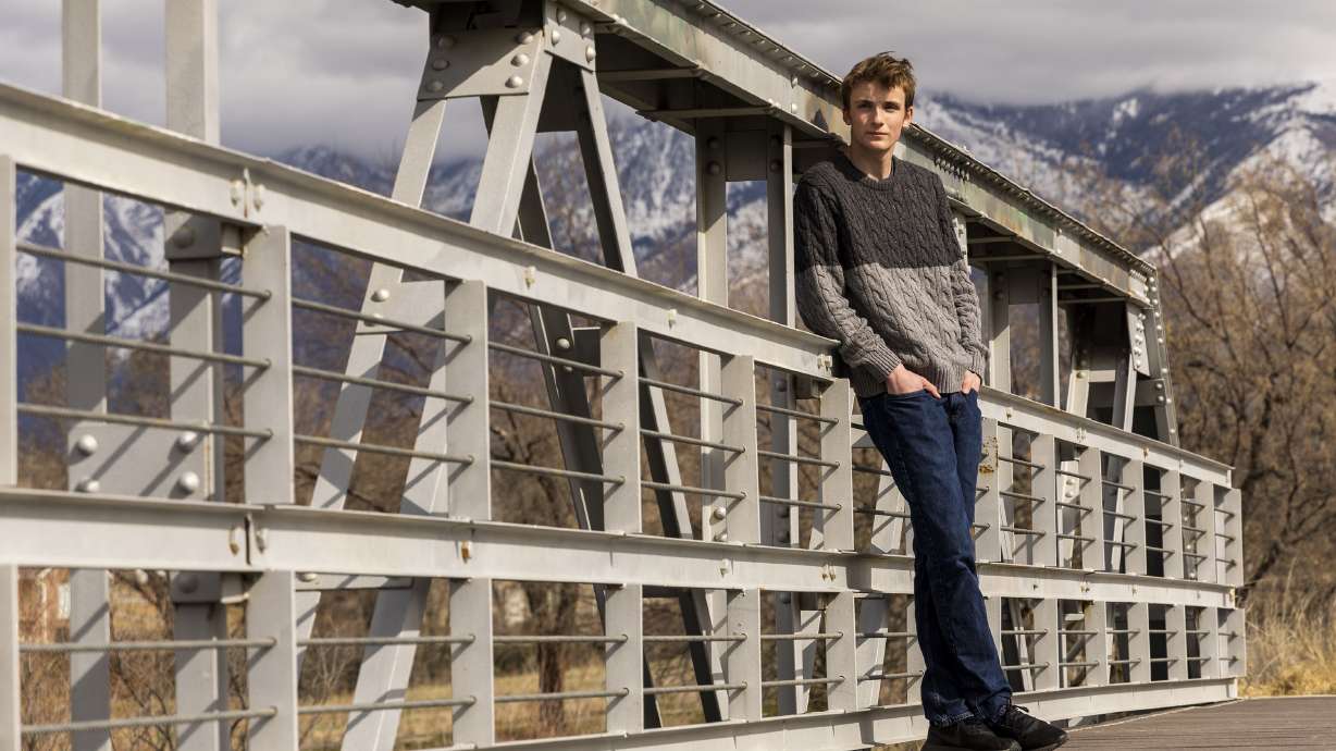 Dallin Rima, a 17-year-old senior at Hillcrest High School, poses for photos in Riverton, Utah, on Wednesday. Rima is one of seven young people in Utah that filed a new constitutional climate lawsuit against the state government, asserting that Utah is actively causing and contributing to the climate crisis.