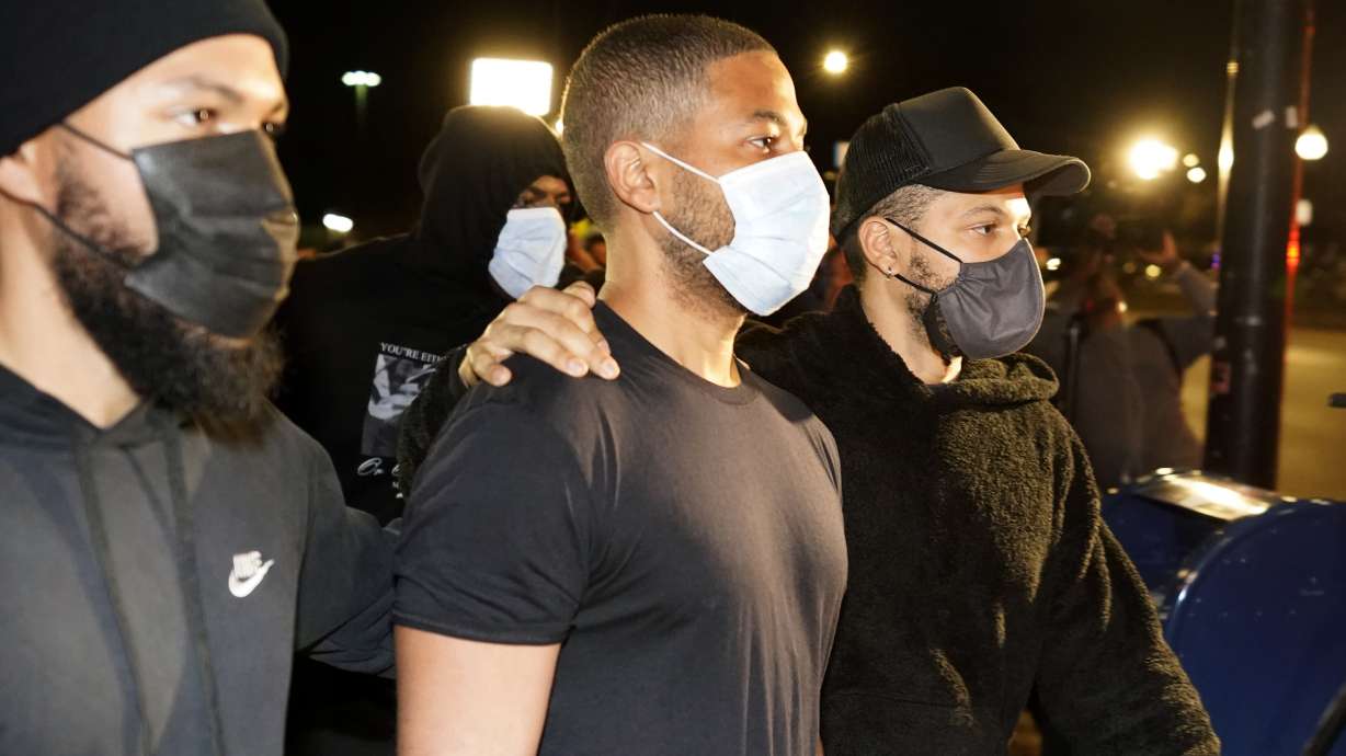 Actor Jussie Smollett, center, leaves the Cook County Jail Wednesday, after an appeals court agreed with his lawyers that he should be released pending the appeal of his conviction for lying to police about a racist and homophobic attack in Chicago.