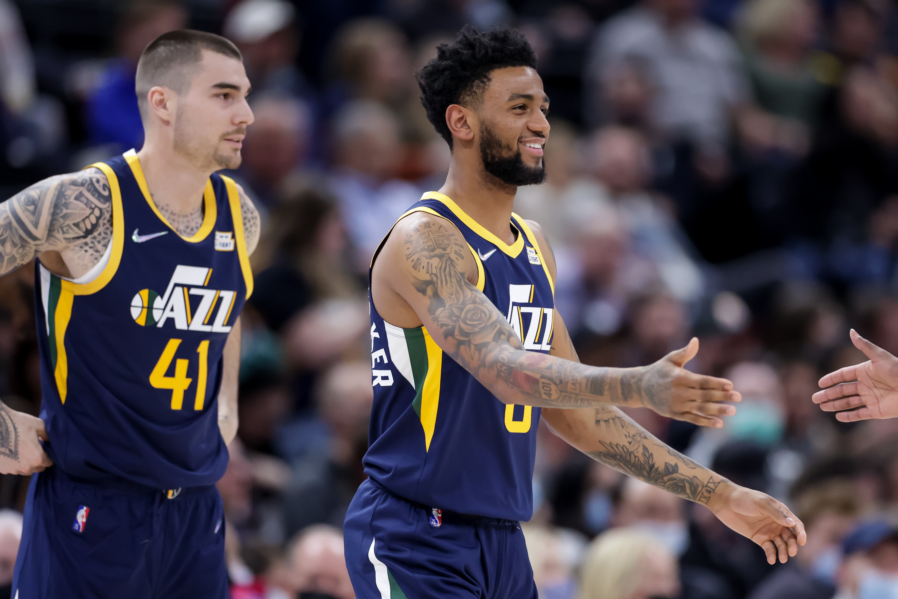 Utah Jazz forward Juancho Hernangomez (41) and guard Nickeil Alexander-Walker (6), both new to the Utah Jazz, take the court during a game.