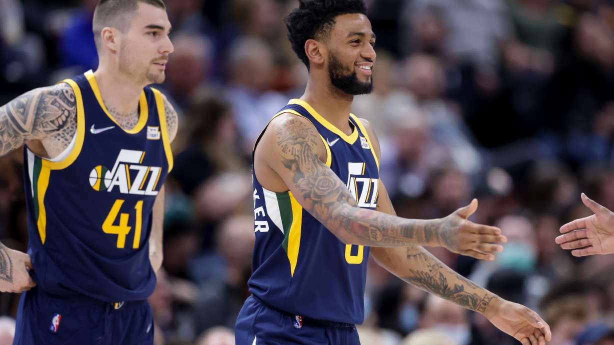 Utah Jazz forward Juancho Hernangomez (41) and guard Nickeil Alexander-Walker (6), both new to the Utah Jazz, take the court during a game.