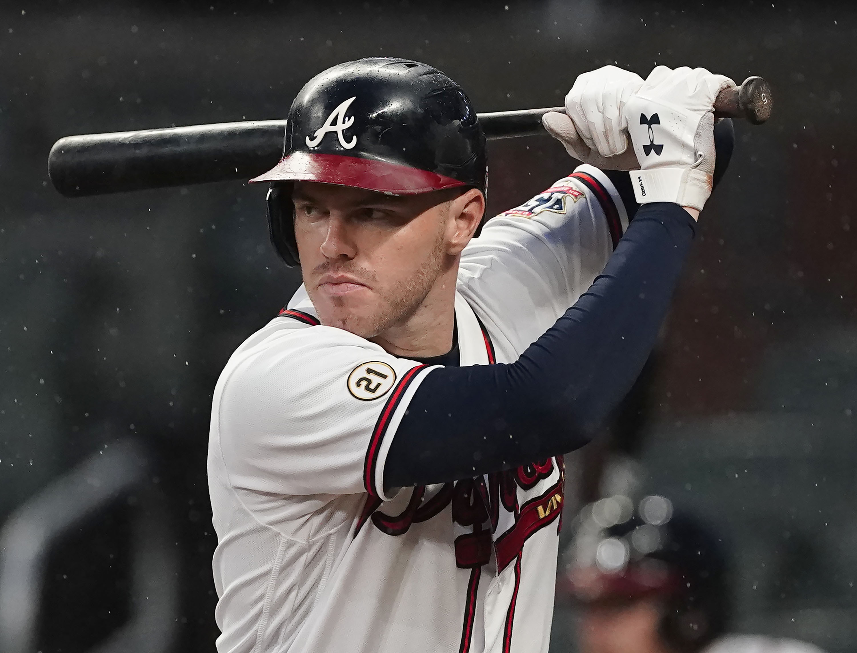 FILE - Atlanta Braves' Freddie Freeman (5) bats during a baseball game against the Colorado Rockies, Sept. 15, 2021, in Atlanta. Freeman, Carlos Correa, and Kris Bryant are among 138 free agents set to resume looking for a spot after a freeze on roster transactions lifts with the signing of baseball's new labor deal.
