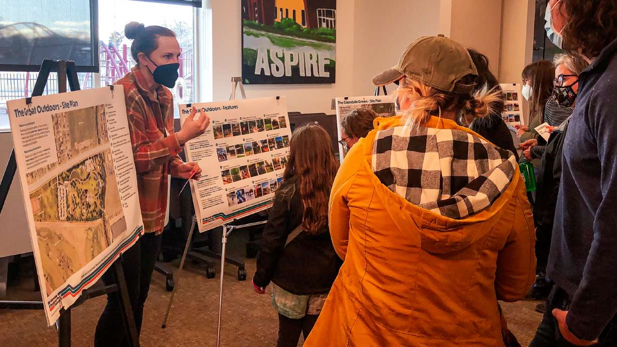 Katherine Maus, a public lands planner for Salt Lake City Park & Public Lands, speaks with residents about the future Glendale Regional Park during an open house at the Glendale-Mountain View Community Center Wednesday. City planners began a vision plan survey earlier in the day.