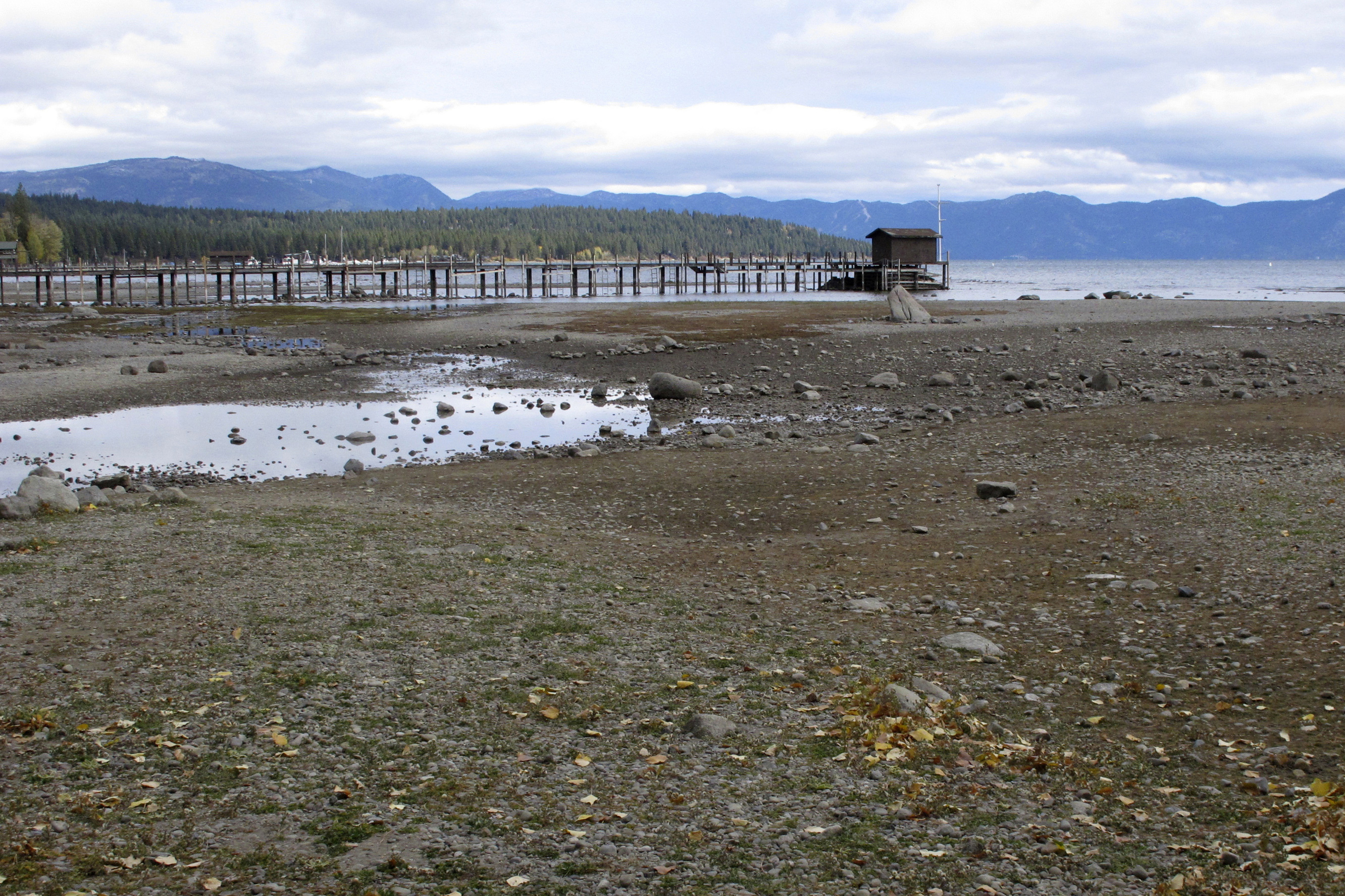 A pier and dock sits above Lake Tahoe's receding shoreline Wednesday, Oct. 20, 2021 at Tahoe City, Calif. There’s no relief in sight for the West’s record-shattering megadrought, which will likely only deepen this spring, the National Oceanic and Atmospheric Administration said in its seasonal outlook Thursday.