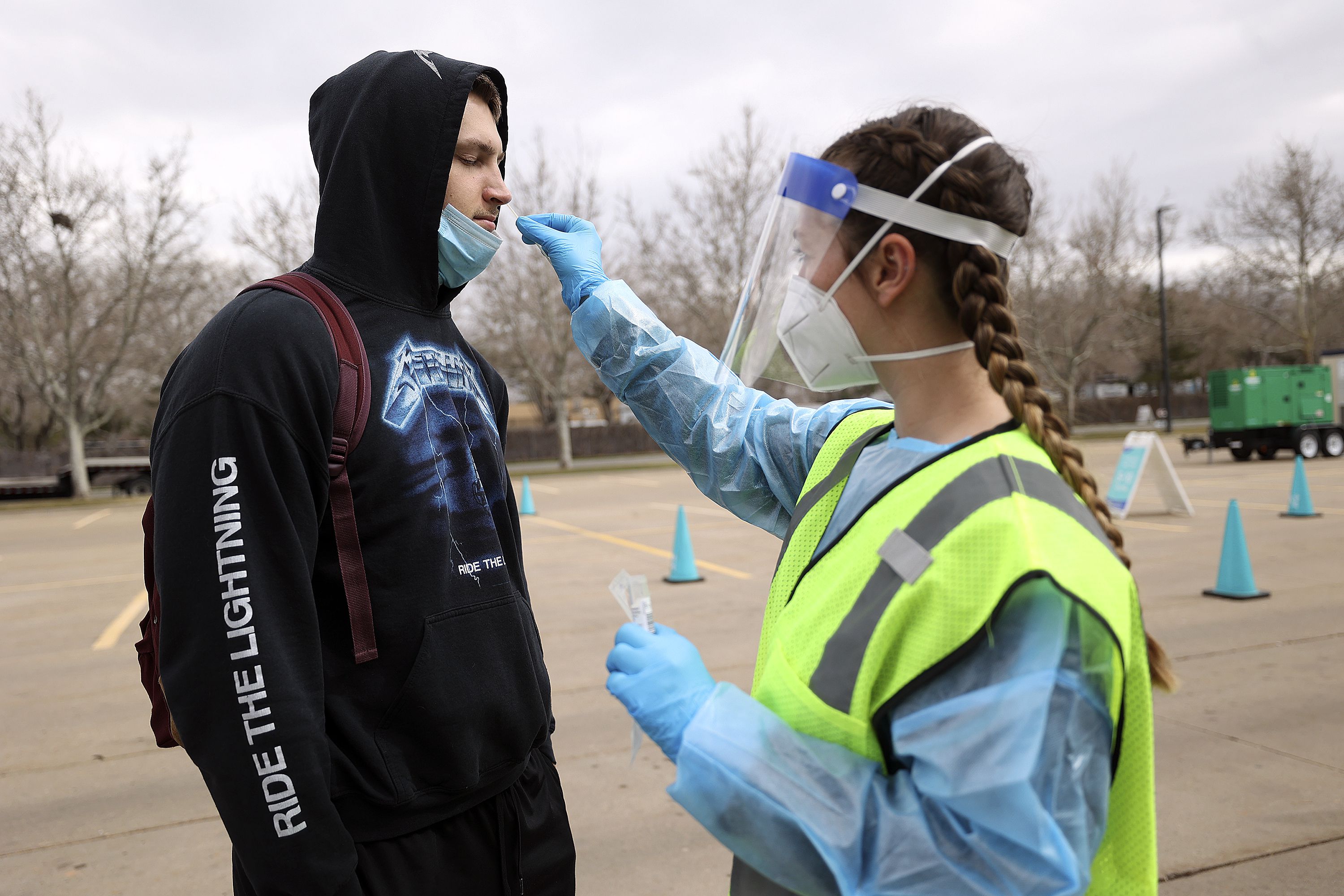 Nurse Megan Christley swabs Mason Stoup’s nose for a COVID-19 test at a Nomi Health testing site outside of the Utah Department of Health building in Salt Lake City on March 16. Utah is now "ramping down" its COVID-19 response just over two years since the pandemic began.