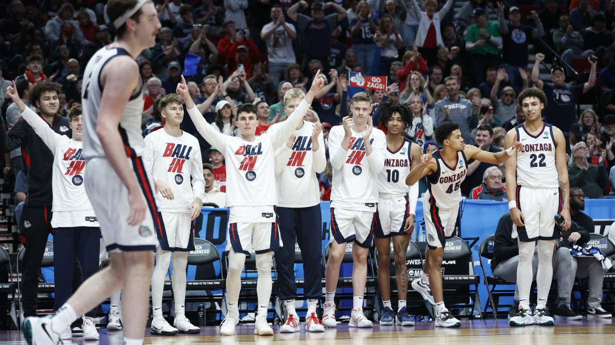 Players on the Gonzaga bench cheer for Gonzaga forward Drew Timme, left, during the second half of a first round NCAA college basketball tournament game against Georgia State, Thursday, March 17, 2022, in Portland, Ore.