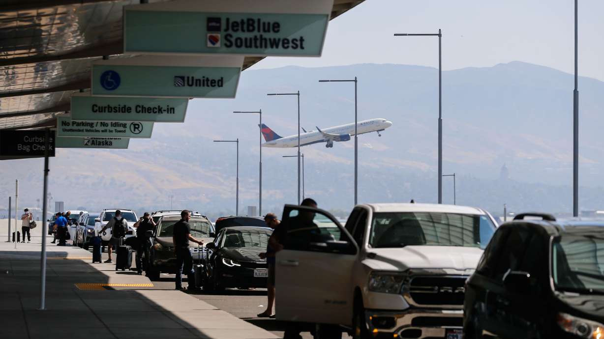 A Delta Air Lines plane takes off as passengers arrive and leave the Salt Lake City International Airport on Sept. 15, 2021.
