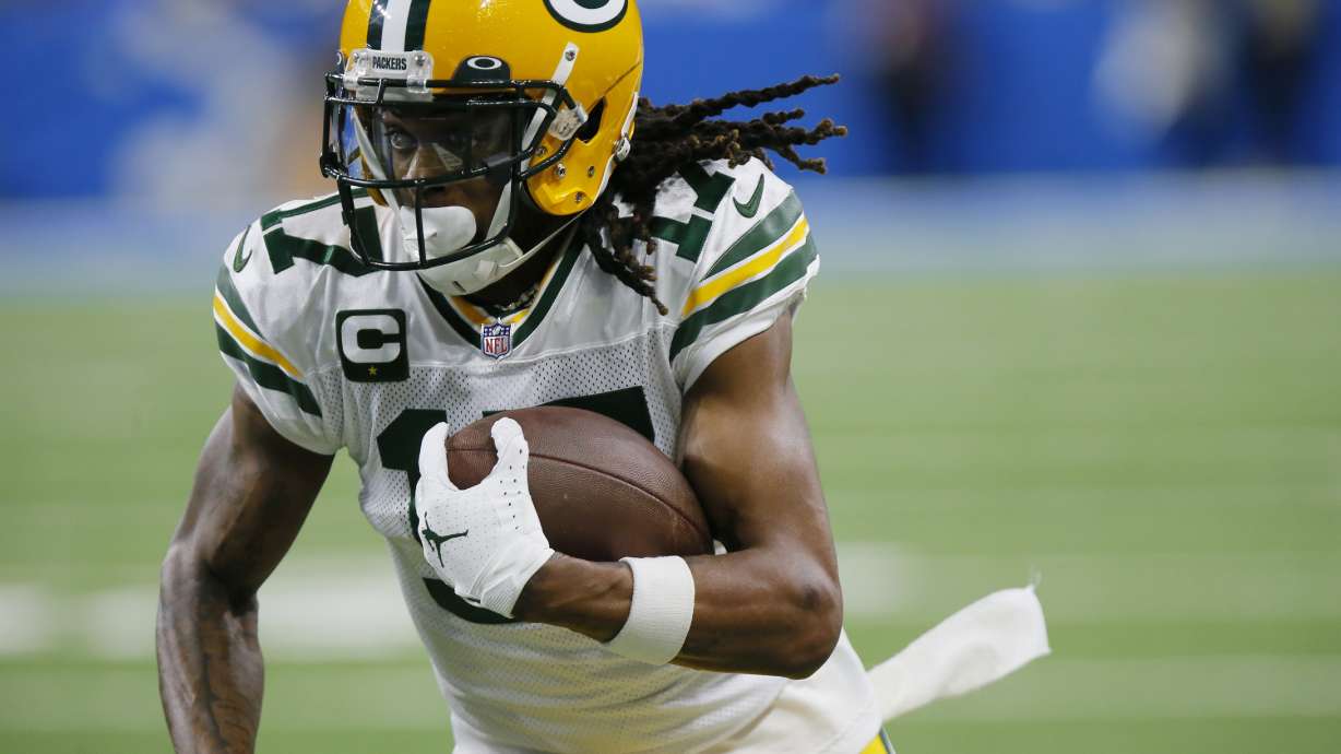 FILE - Green Bay Packers wide receiver Davante Adams runs during the first half of the team's NFL football game against the Detroit Lions on Jan. 9, 2022, in Detroit. The Las Vegas Raiders have traded two draft picks to Green Bay for All-Pro receiver Adams. A person familiar with the move said Thursday, March 17, the Raiders are sending the No. 22 overall pick in April's draft and another draft pick to the Packers to reunited Adams with his college quarterback Derek Carr. The person spoke on condition of anonymity because the deal hadn't been announced.