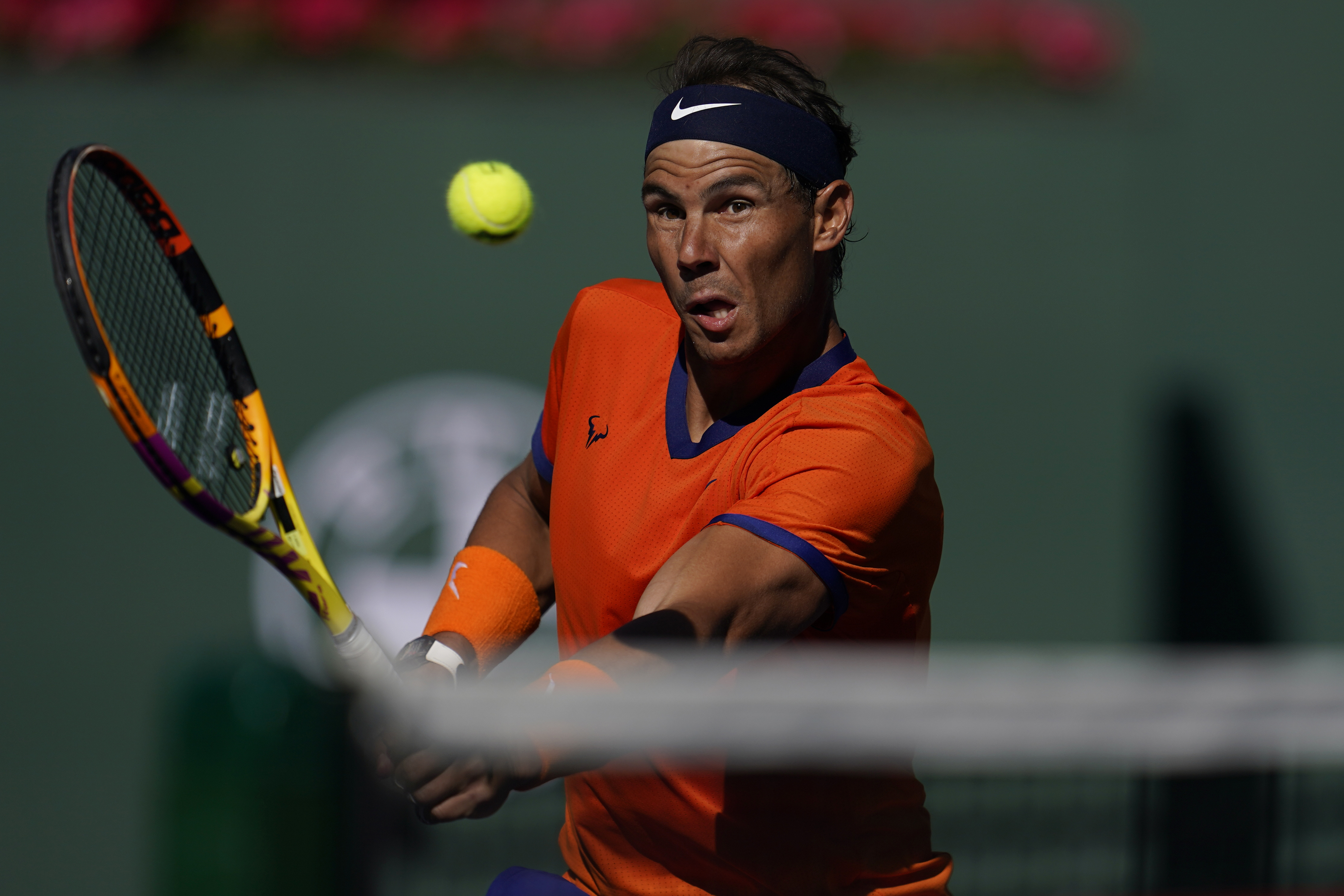Rafael Nadal, of Spain, returns to Nick Kyrgios, of Australia, during a quarterfinal match in the BNP Paribas Open tennis tournament Thursday, March 17, 2022, in Indian Wells, Calif. 
