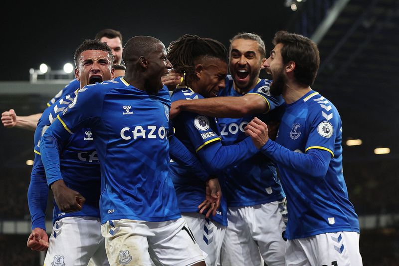 Soccer Football - Premier League - Everton v Newcastle United - Goodison Park, Liverpool, Britain - March 17, 2022 Everton's Alex Iwobi celebrates scoring their first goal with teammates