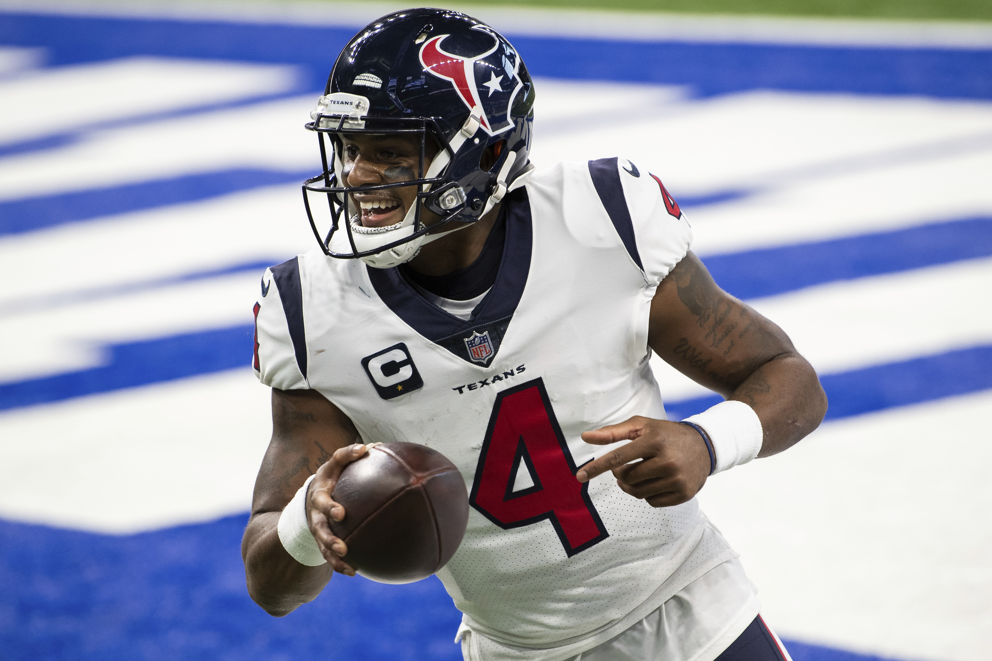 FILE - Houston Texans quarterback Deshaun Watson (4) celebrates a touchdown during the team's NFL football game against the Indianapolis Colts on Dec. 20, 2020, in Indianapolis. Several teams are scrambling to find a quarterback. Some of those, including Carolina, New Orleans and Cleveland, have been in discussions with Watson, who sat out last season. 