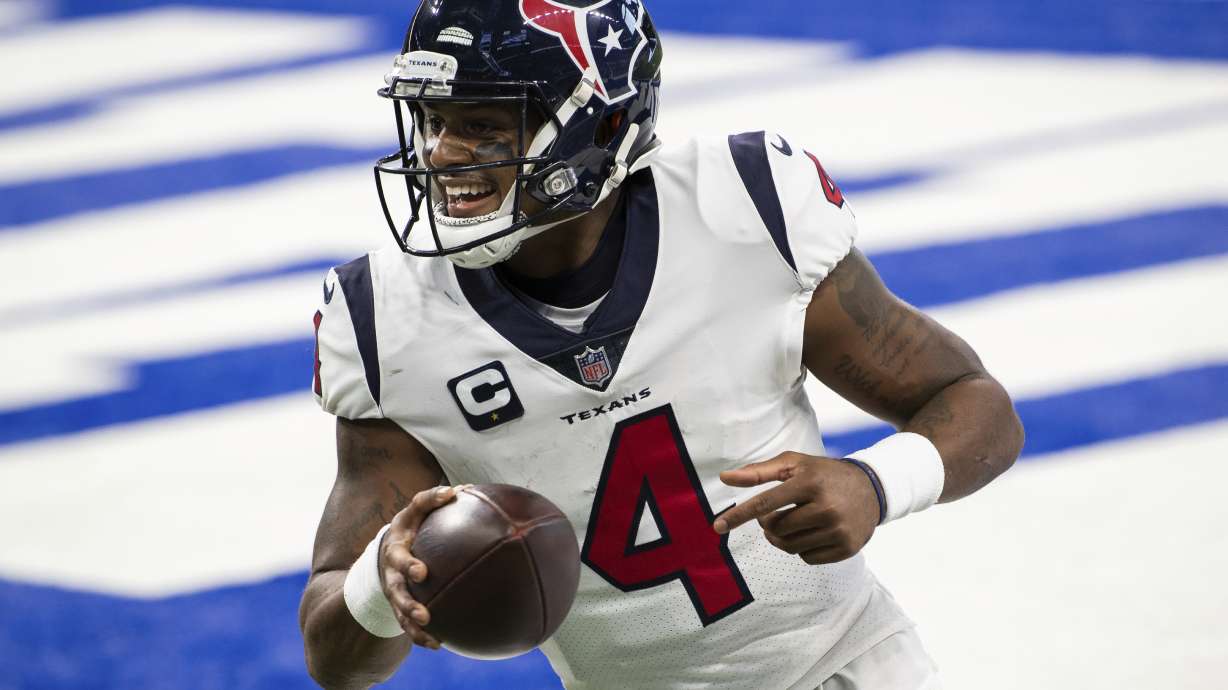 FILE - Houston Texans quarterback Deshaun Watson (4) celebrates a touchdown during the team's NFL football game against the Indianapolis Colts on Dec. 20, 2020, in Indianapolis. Several teams are scrambling to find a quarterback. Some of those, including Carolina, New Orleans and Cleveland, have been in discussions with Watson, who sat out last season.