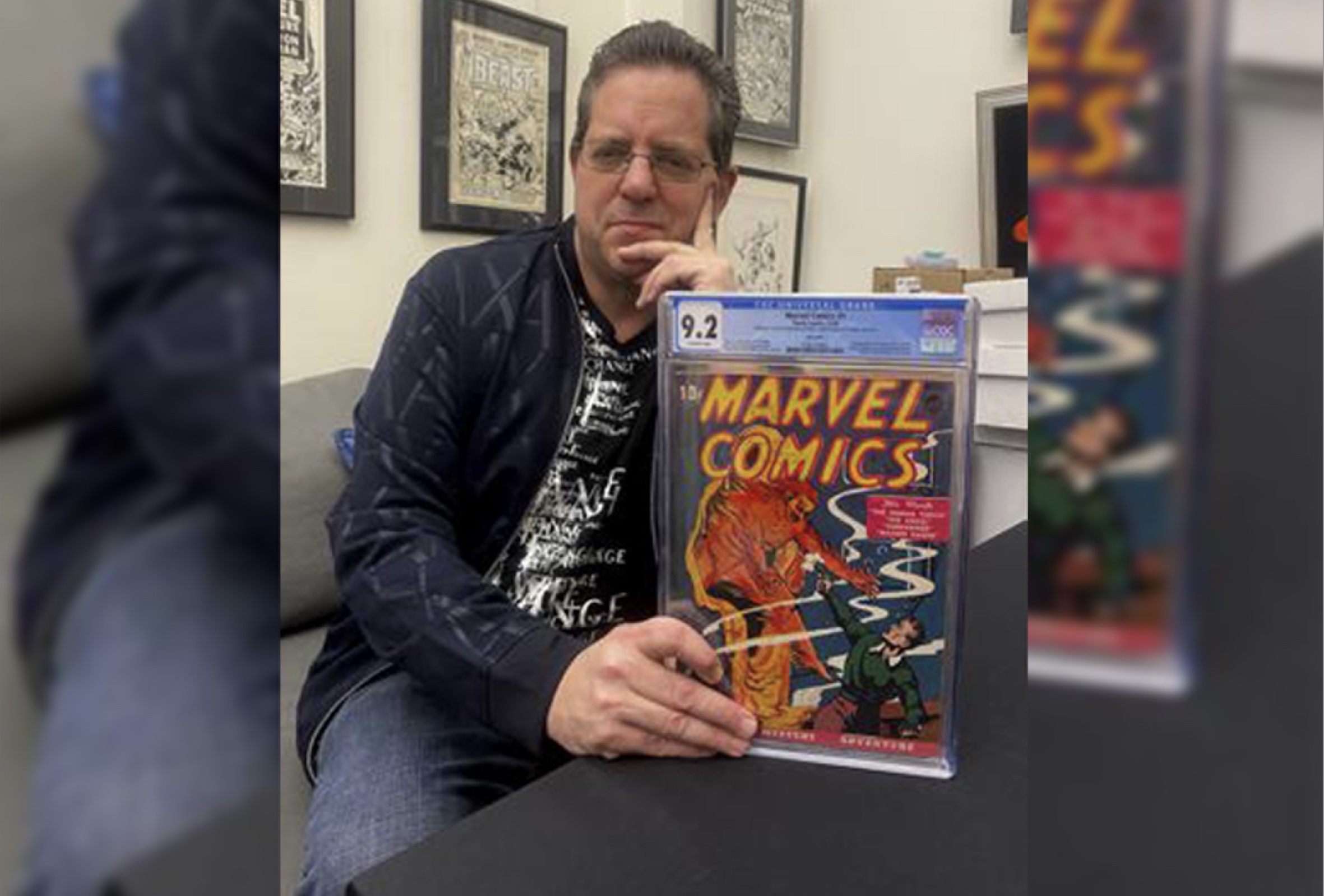 Stephen Fishler, co-owner and CEO of ComicConnect.com, poses for a photo holding up a copy of Marvel Comics #1, Friday, in New York. The prized copy of the first-ever Marvel comic book has fetched over $2.4 million in an online auction.
