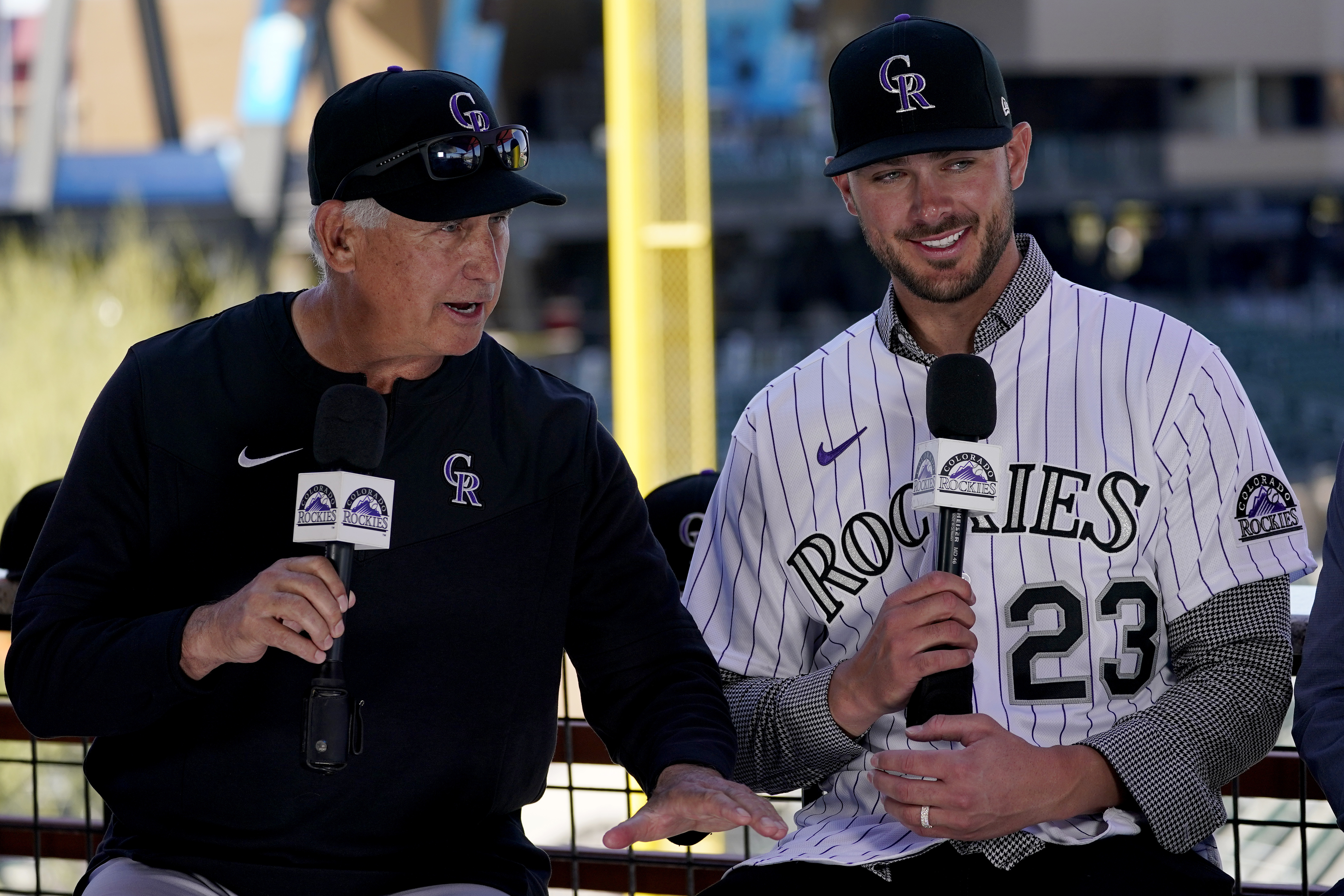 Colorado Rockies baseball team manager Bud Black, left, introduces newly acquired third baseman Kris Bryant, Friday, March 18, 2022, at spring training in Scottsdale, Ariz. 