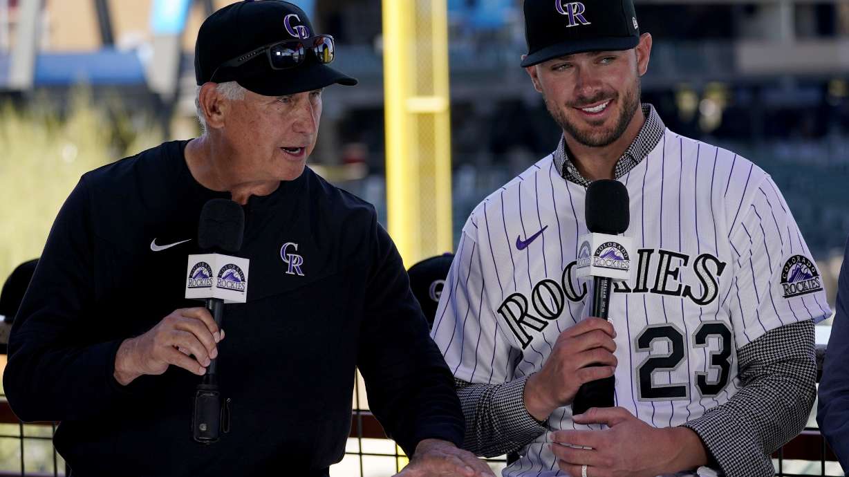 Colorado Rockies baseball team manager Bud Black, left, introduces newly acquired third baseman Kris Bryant, Friday, March 18, 2022, at spring training in Scottsdale, Ariz.