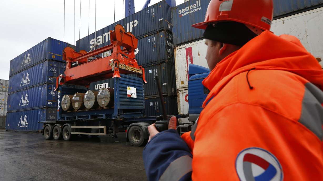 A crane loads containers with uranium to be used as fuel for nuclear reactors aboard the Atlantic Navigator ship, on a port in St. Petersburg, Russia, on Nov. 14, 2013. A Ukrainian energy coalition made up of seven organizations and a municipality in the war-torn country sent a direct appeal to President Joe Biden to cease importing Russian uranium.