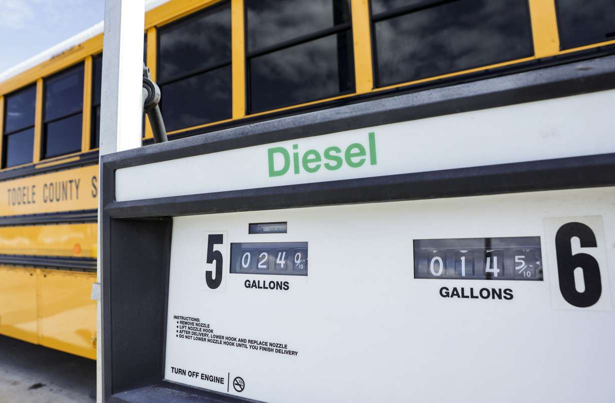 A diesel pump is pictured in front of a Tooele County School District bus, which holds about a hundred gallons of fuel, at a state fueling center in Tooele on Friday.
