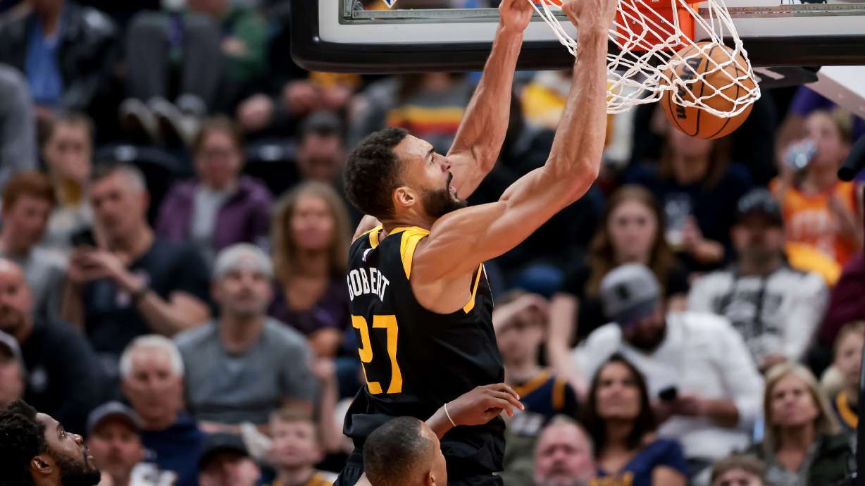 Utah Jazz center Rudy Gobert (27) dunks during the game against the LA Clippers at Vivint Arena in Salt Lake City on Friday, March 18, 2022.