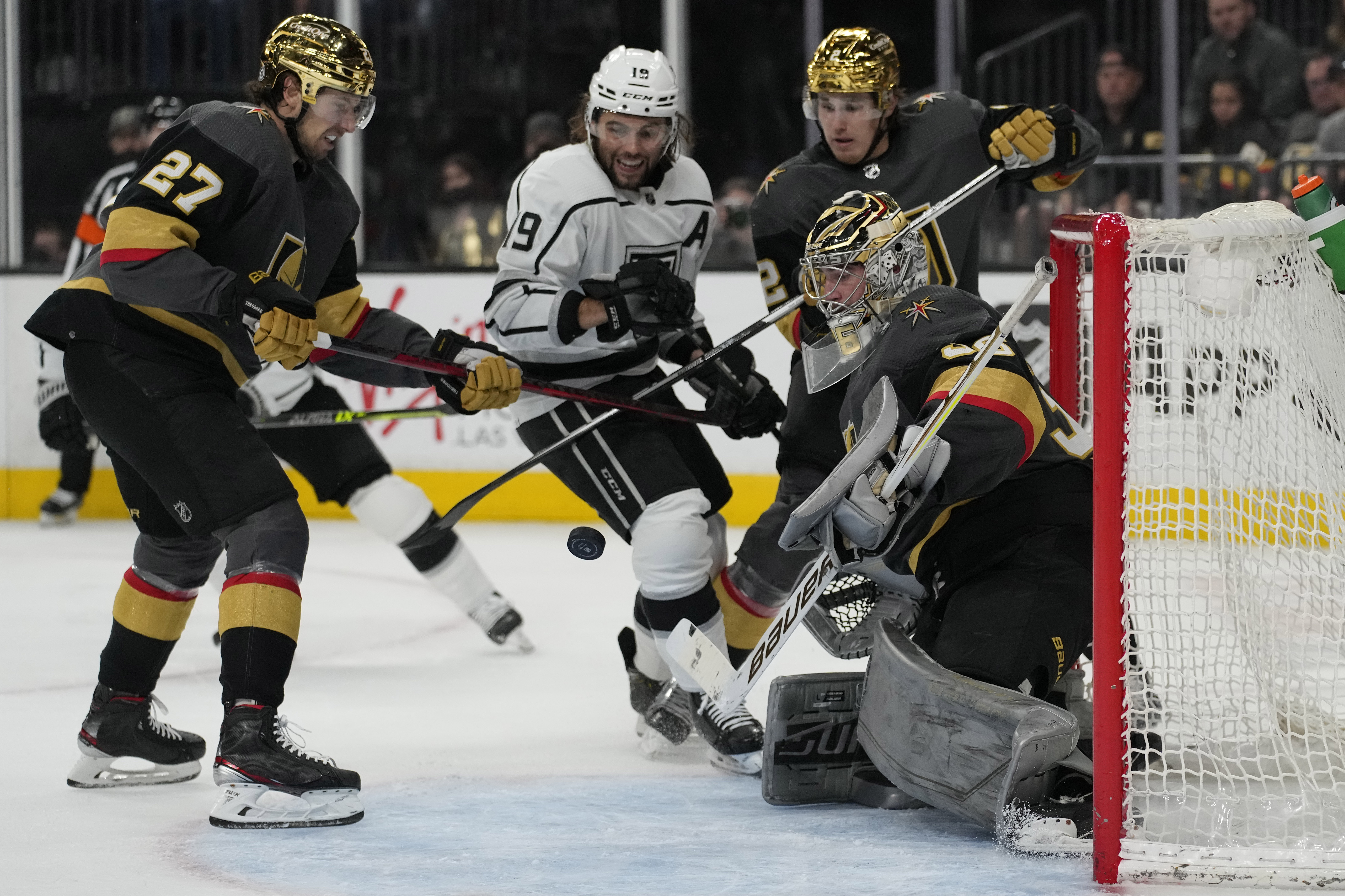 Vegas Golden Knights goaltender Logan Thompson (36) blocks a shot by the Los Angeles Kings during the third period of an NHL hockey game Saturday, March 19, 2022, in Las Vegas. 