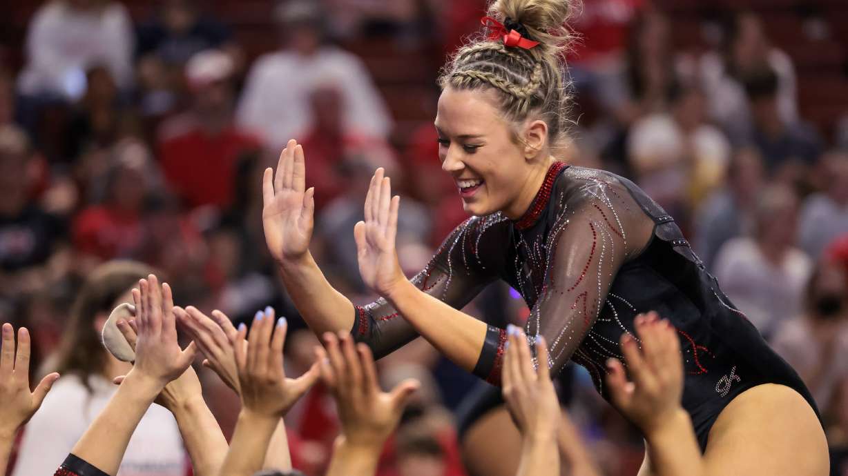 Utah’s Jaylene Gilstrap celebrates after performing her floor routine during the Pac-12 women’s gymnastics championship at the Maverik Center in West Valley City on Saturday, March 19, 2022.