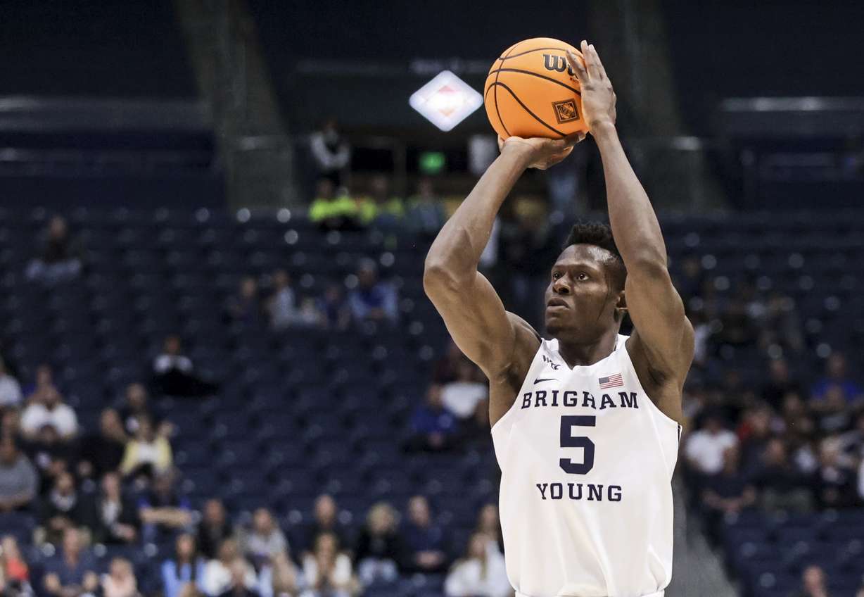 Brigham Young forward Gideon George (5) shoots a 3-pointer as Brigham Young Cougars plays Northern Iowa Panthers in a NIT game at the Marriott Center in Provo on Saturday, March 19, 2022. BYU won 90-71.