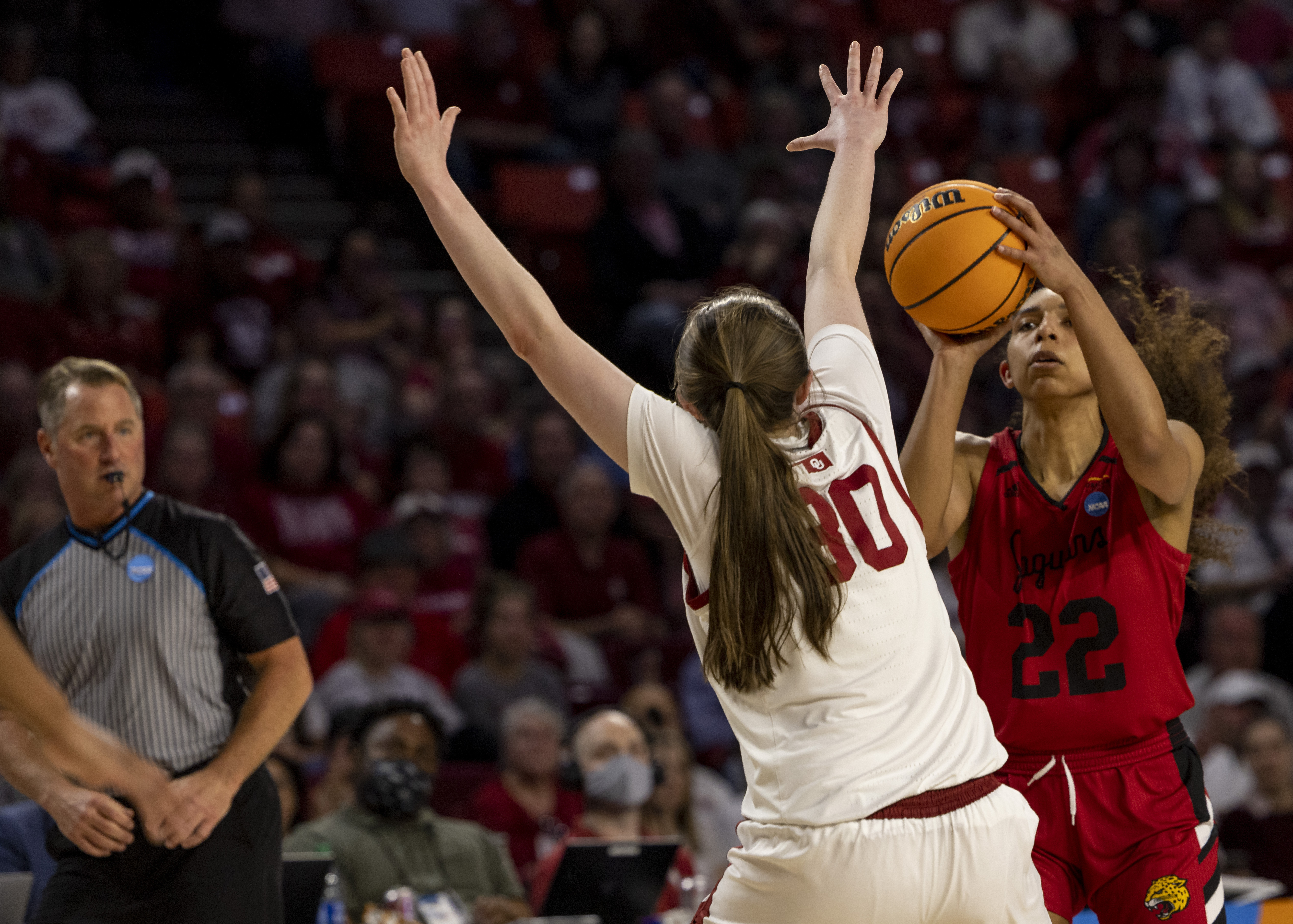 IUPUI guard Rachel Kent (22) shoots over Oklahoma guard Taylor Robertson (30) in the first half of a first-round game in the NCAA women's college basketball tournament Saturday, March 19, 2022, in Norman, Okla. 