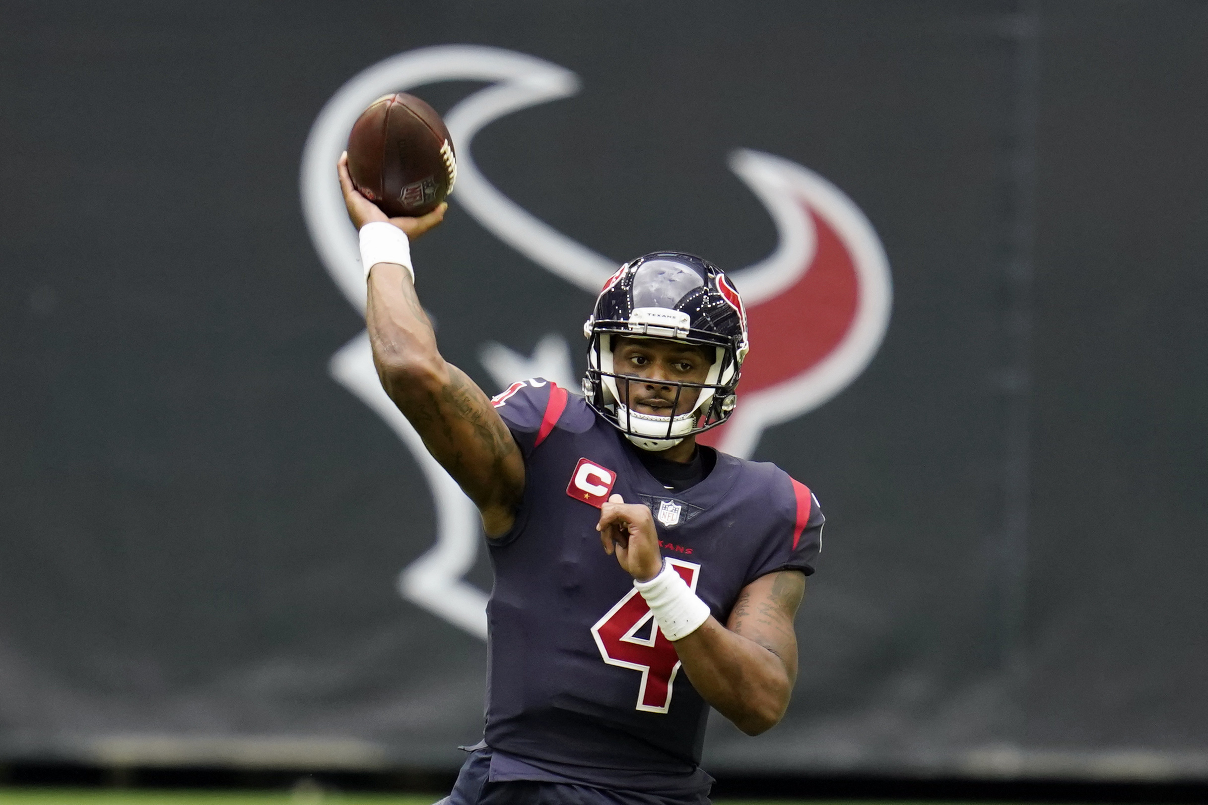 FILE - In this Dec. 27, 2020, file photo, Houston Texans quarterback Deshaun Watson throws a pass during an NFL football game against the Cincinnati Bengals in Houston. A person familiar with the decision tells AP quarterback Deshaun Watson has changed his mind and will accept a trade to the Cleveland Browns, Friday, March 18, 2022. 