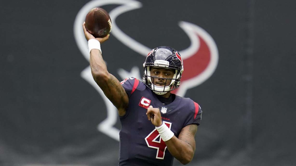 FILE - In this Dec. 27, 2020, file photo, Houston Texans quarterback Deshaun Watson throws a pass during an NFL football game against the Cincinnati Bengals in Houston. A person familiar with the decision tells AP quarterback Deshaun Watson has changed his mind and will accept a trade to the Cleveland Browns, Friday, March 18, 2022.