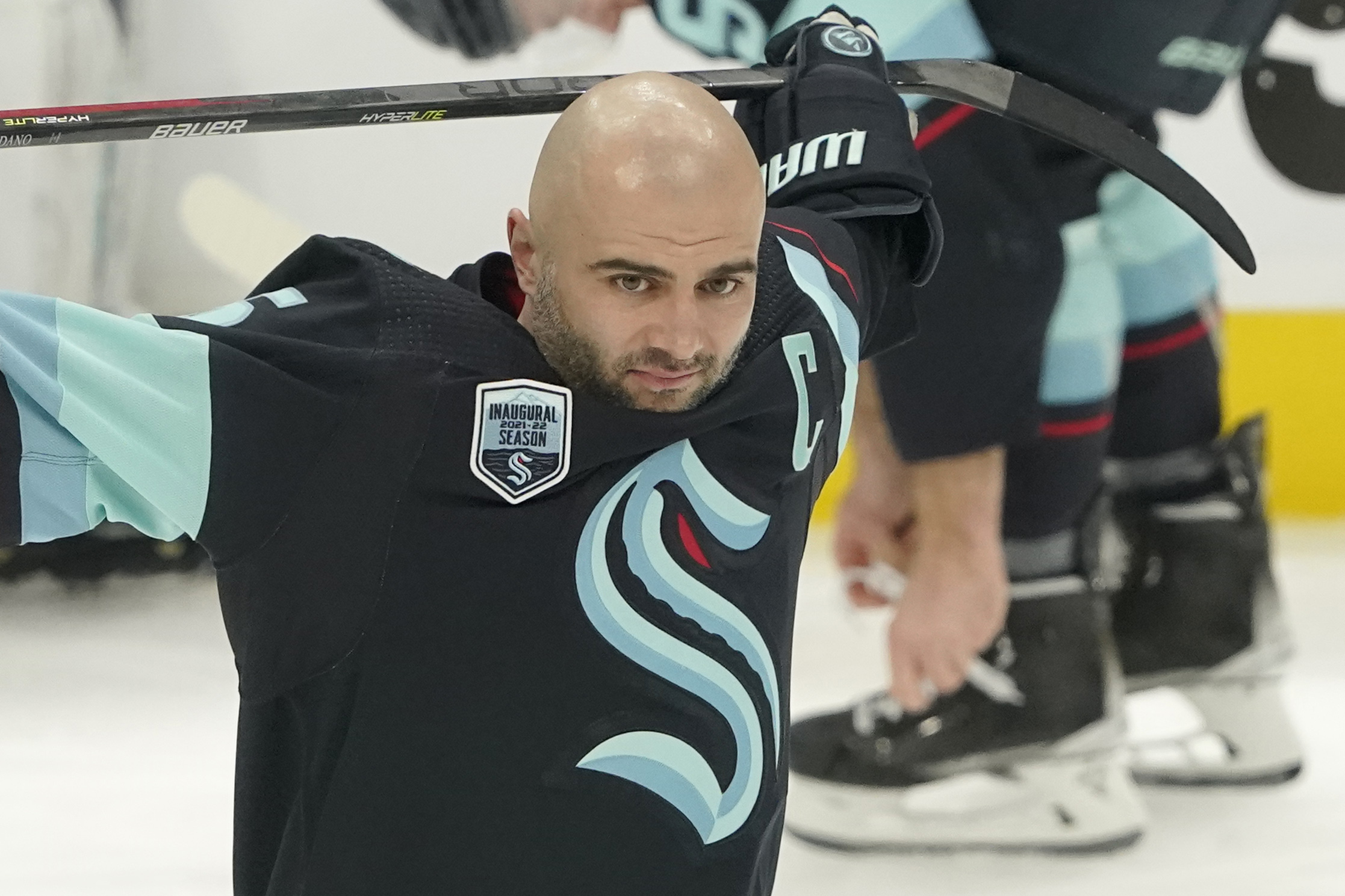 Seattle Kraken defenseman Mark Giordano holds his stick during warmups before an NHL hockey game against the Tampa Bay Lightning, Wednesday, March 16, 2022, in Seattle. Giordano was honored before the game for his 1000th career NHL game, which took place March 5, 2022 on the road against the Washington Capitals. 