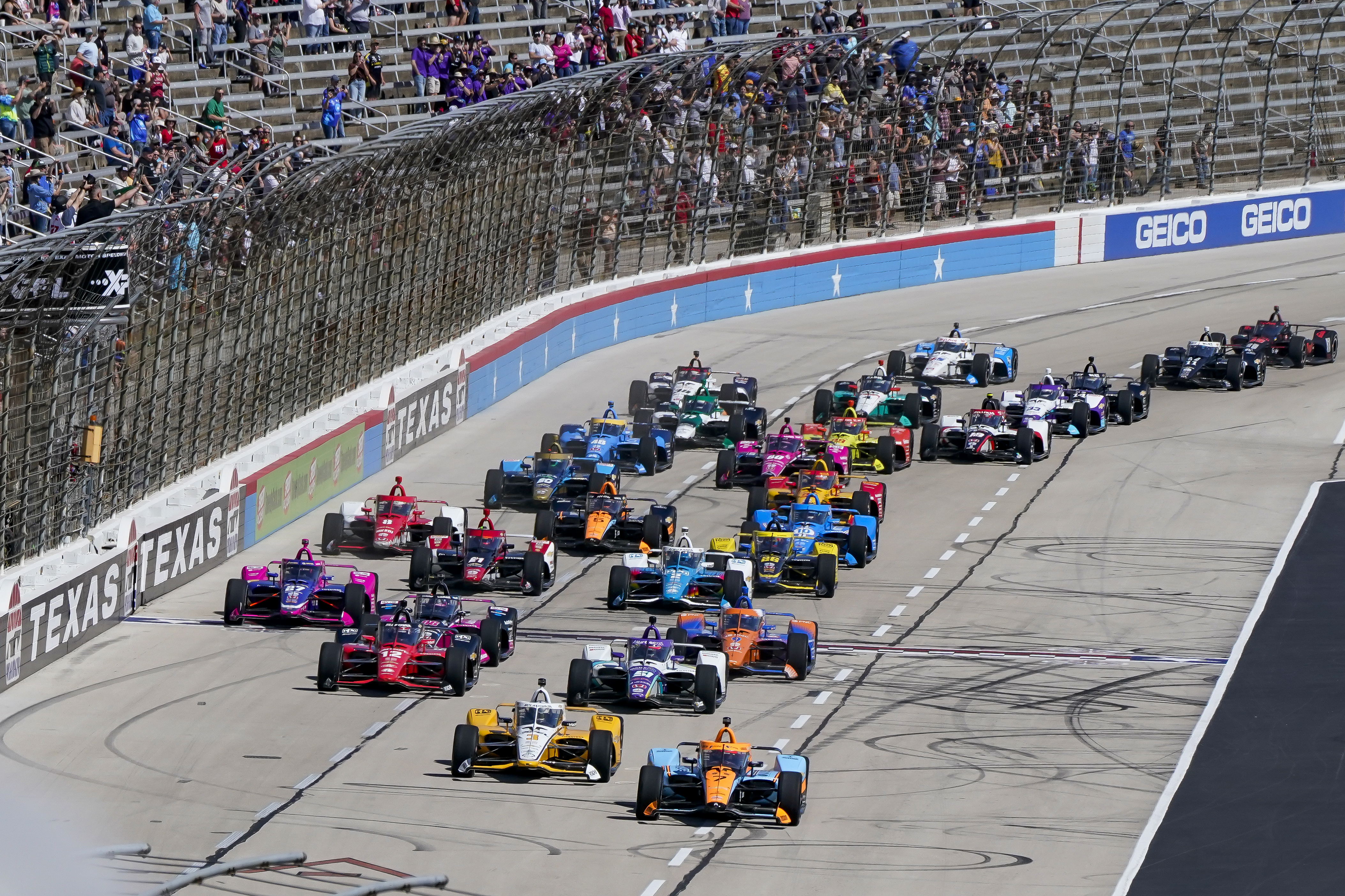 Racers vie for position at the beginning of the NTT IndyCar Series XPEL 375 at Texas Motor Speedway in Fort Worth, Texas, on Sunday, March 20, 2022. 