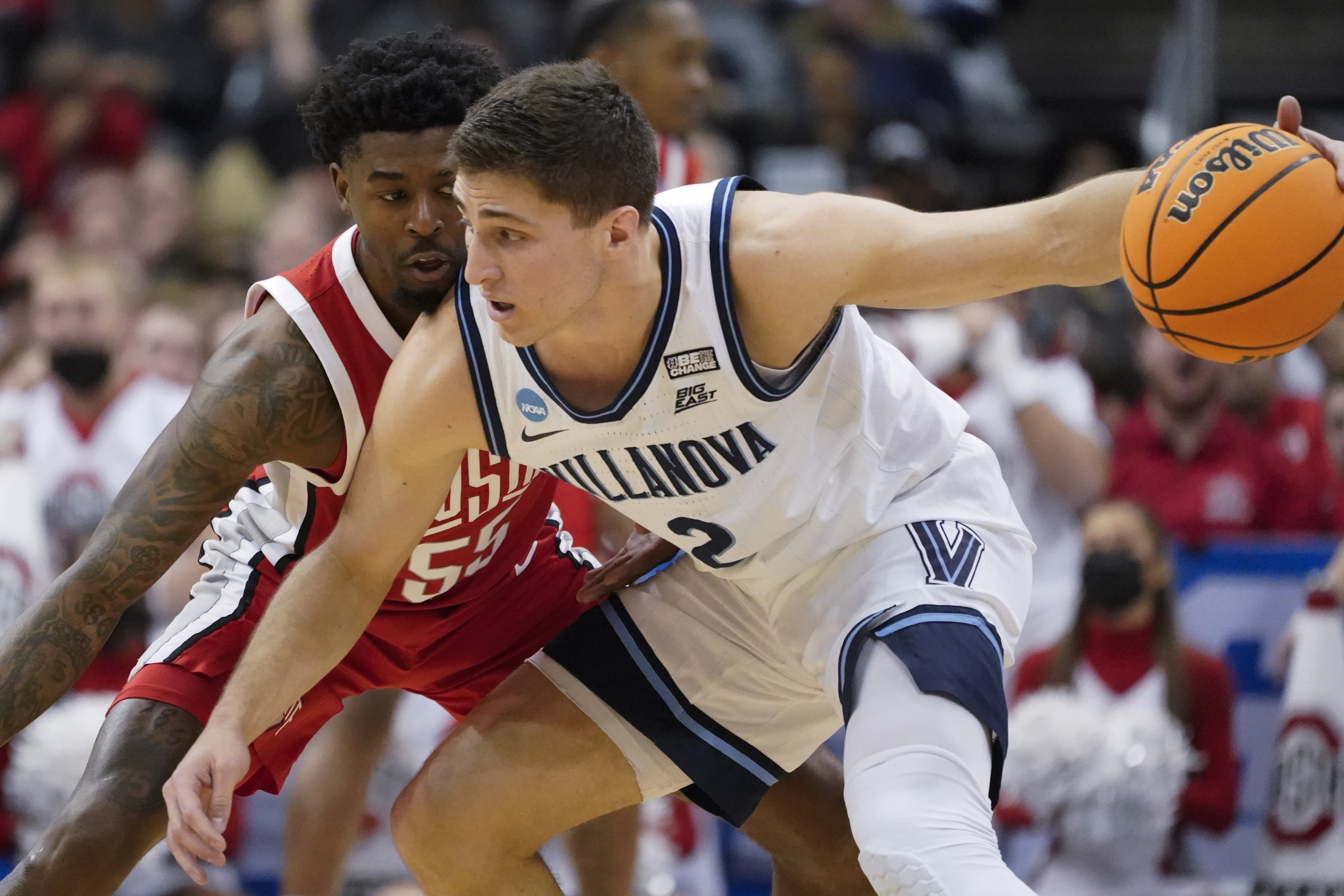 Villanova's Collin Gillespie (2) tries to get the ball past Ohio State's Jamari Wheeler (55) during the first half of a college basketball game in the second round of the NCAA tournament, Sunday, March 20, 2022, in Pittsburgh. 