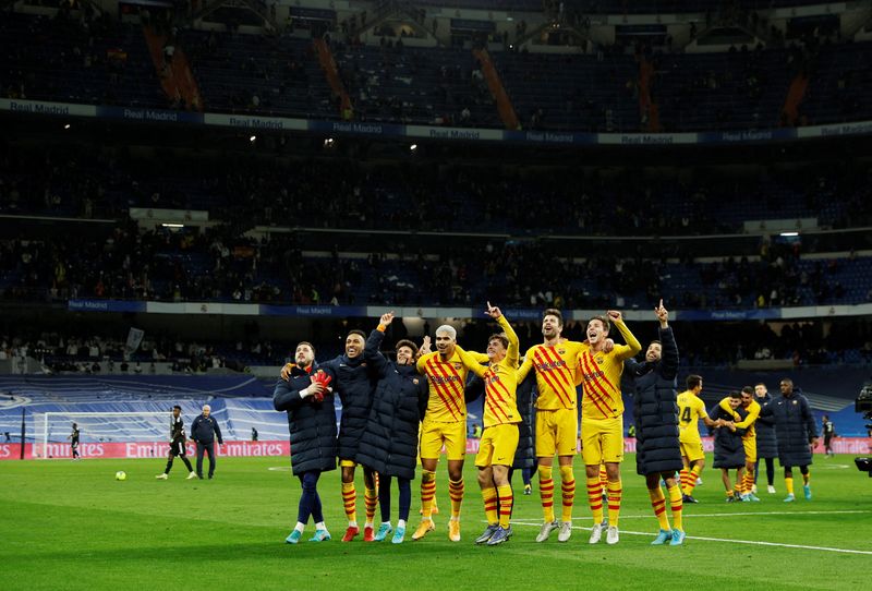 Soccer Football - LaLiga - Real Madrid v FC Barcelona - Santiago Bernabeu, Madrid, Spain - March 20, 2022 FC Barcelona players celebrate after the match