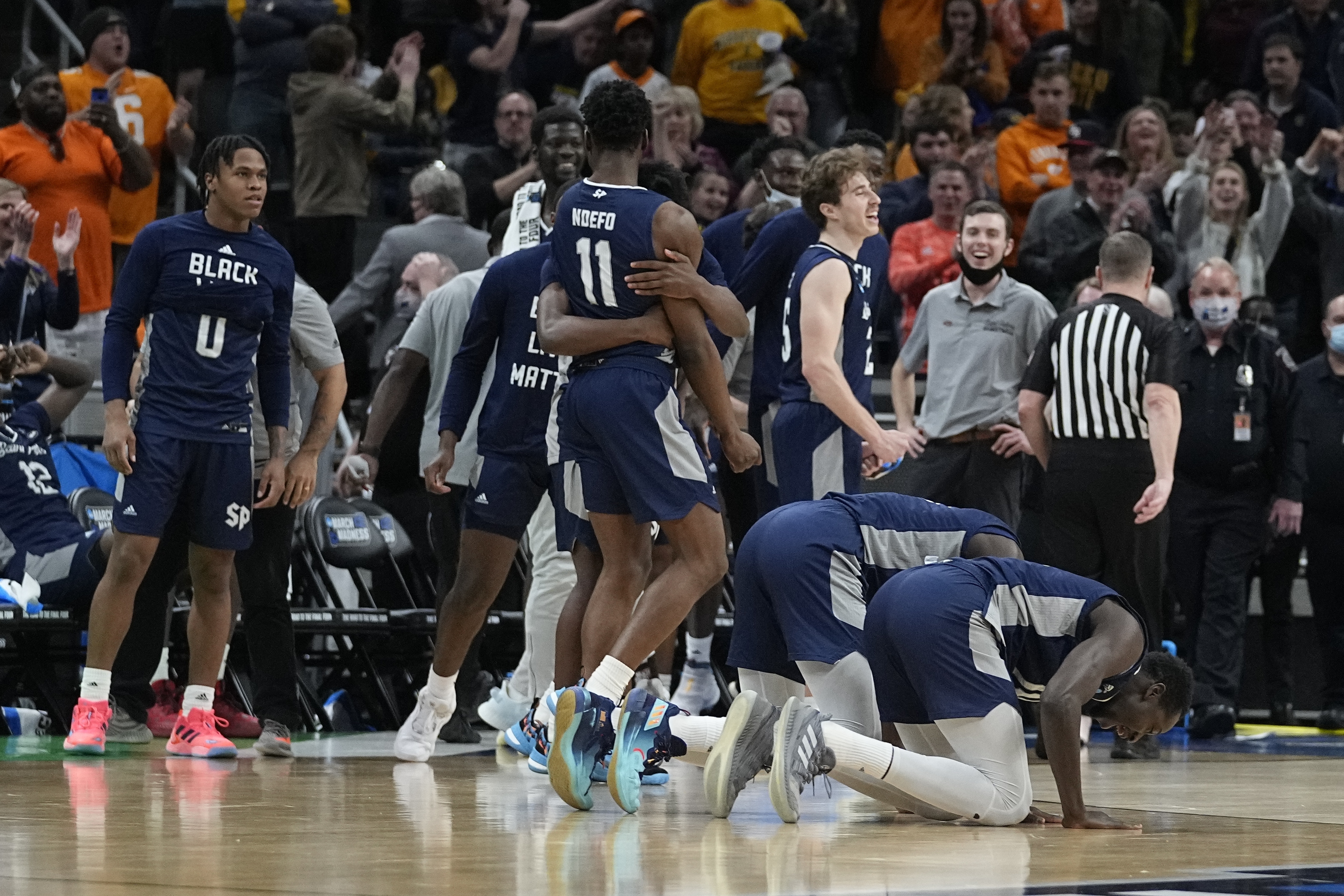 Saint Peter's players celebrate after defeating Murray State in a college basketball game in the second round of the NCAA tournament, Saturday, March 19, 2022, in Indianapolis. 