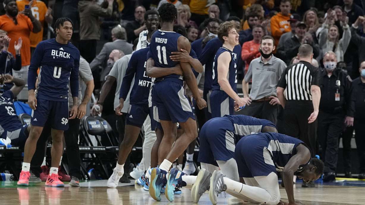 Saint Peter's players celebrate after defeating Murray State in a college basketball game in the second round of the NCAA tournament, Saturday, March 19, 2022, in Indianapolis.