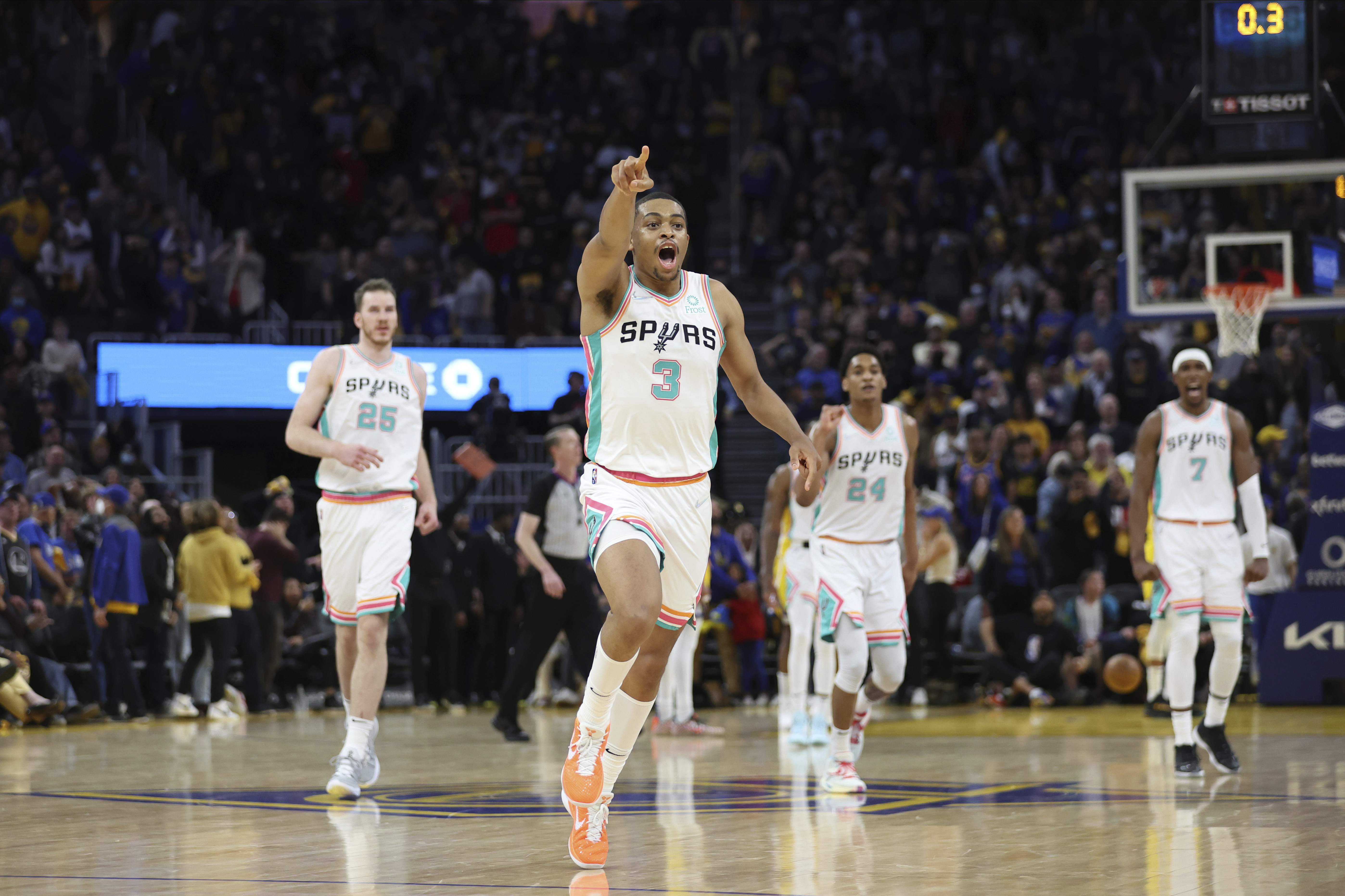 San Antonio Spurs forward Keldon Johnson (3) celebrates after making the winning basket against the Golden State Warriors during the second half of an NBA basketball game in San Francisco, Sunday, March 20, 2022. 
