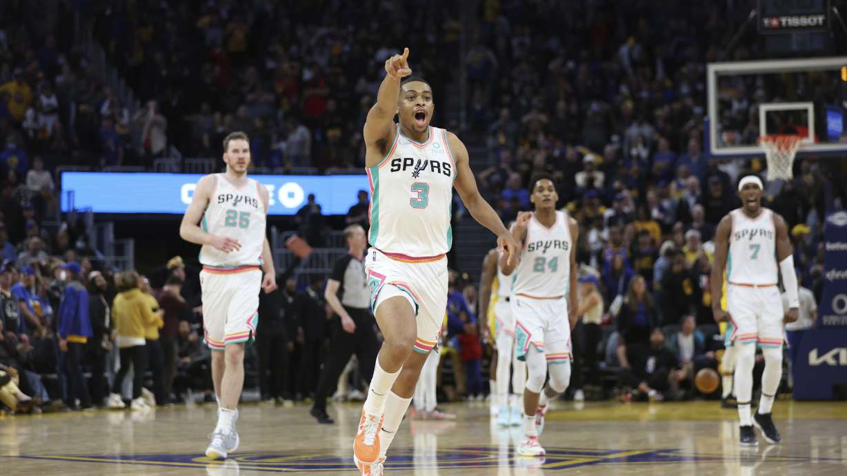 San Antonio Spurs forward Keldon Johnson (3) celebrates after making the winning basket against the Golden State Warriors during the second half of an NBA basketball game in San Francisco, Sunday, March 20, 2022.