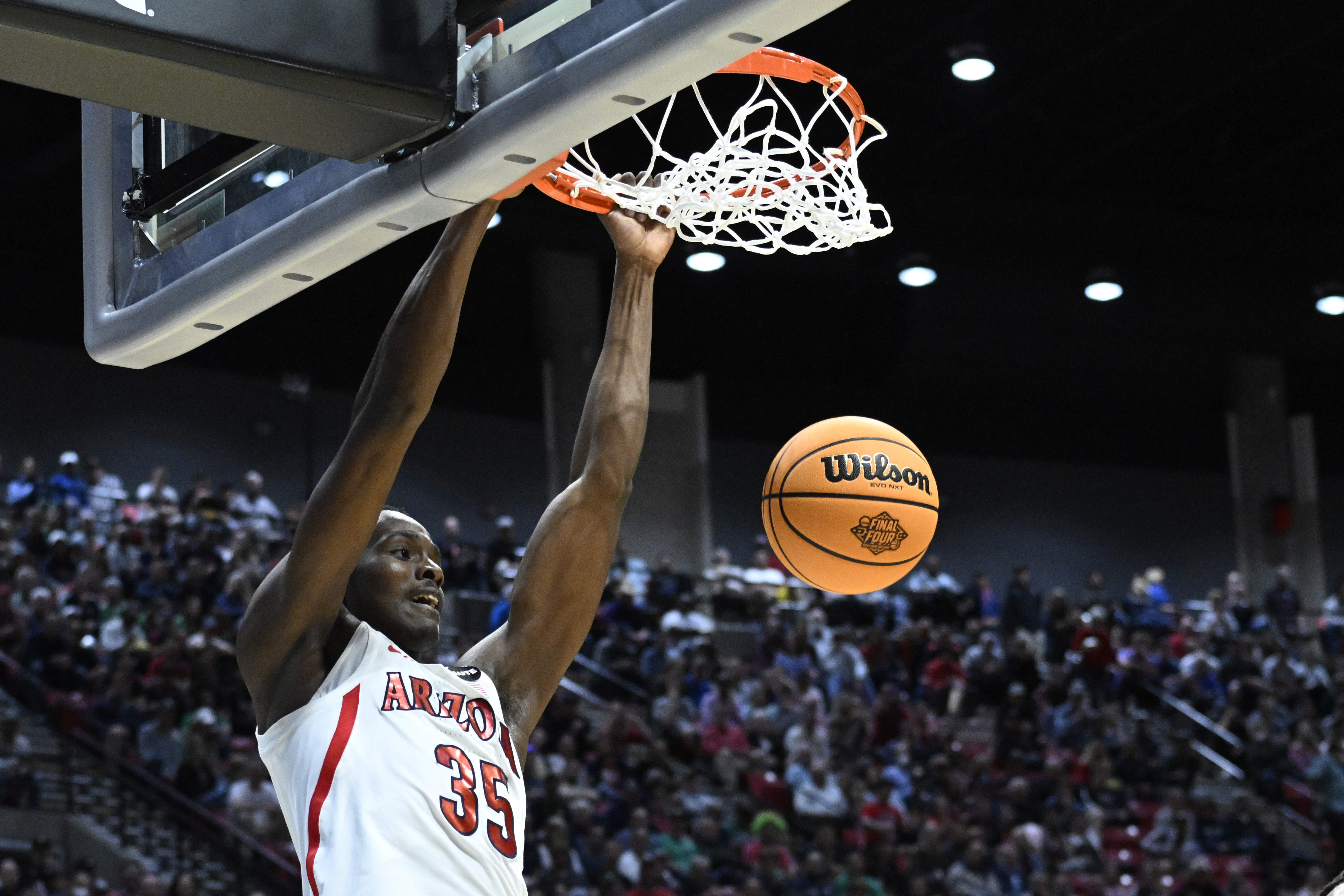 Arizona center Christian Koloko (35) dunks against TCU during the first half of a second-round NCAA college basketball tournament game, Sunday, March 20, 2022, in San Diego. 