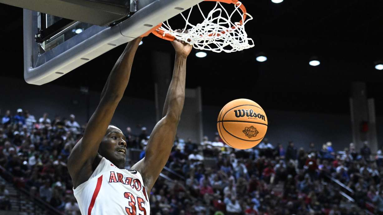 Arizona center Christian Koloko (35) dunks against TCU during the first half of a second-round NCAA college basketball tournament game, Sunday, March 20, 2022, in San Diego.