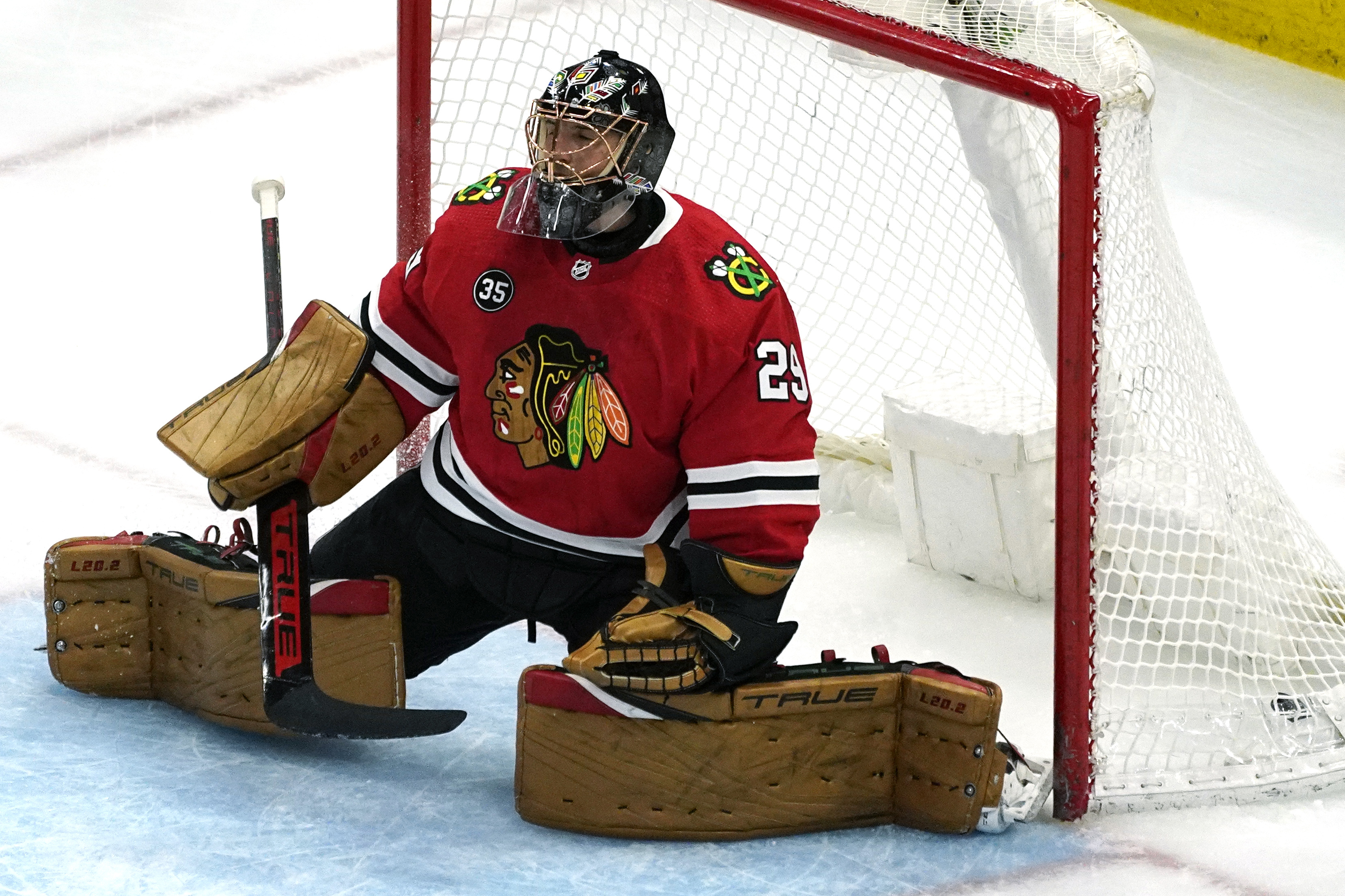 Chicago Blackhawks goaltender Marc-Andre Fleury reacts after Winnipeg Jets left wing Nikolaj Ehlers scored a goal during the first period of an NHL hockey game in Chicago, Sunday, March 20, 2022. 