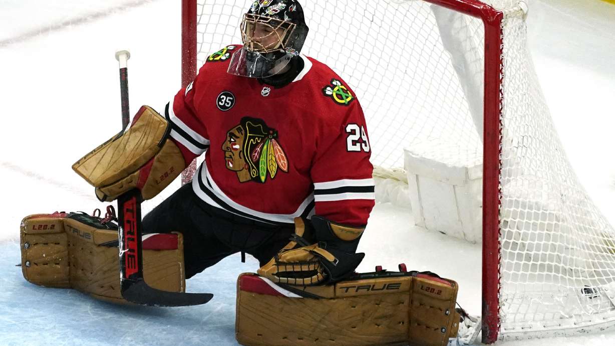 Chicago Blackhawks goaltender Marc-Andre Fleury reacts after Winnipeg Jets left wing Nikolaj Ehlers scored a goal during the first period of an NHL hockey game in Chicago, Sunday, March 20, 2022.