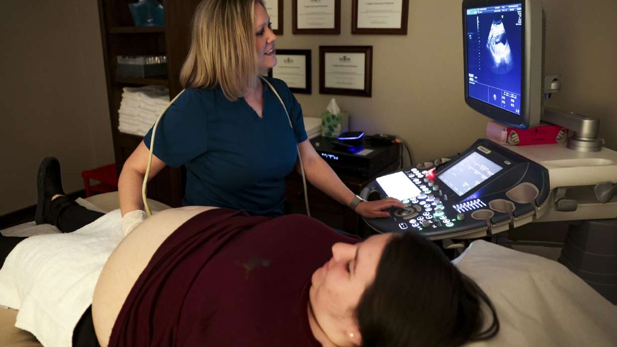 Becky Greene, manager of Fetal Fotos, performs an ultrasound on Angelina Castorena during her third pregnancy at Fetal Fotos in Murray on Monday, March 14. Utah’s total fertility rate has been falling faster than the nation’s since 2009.