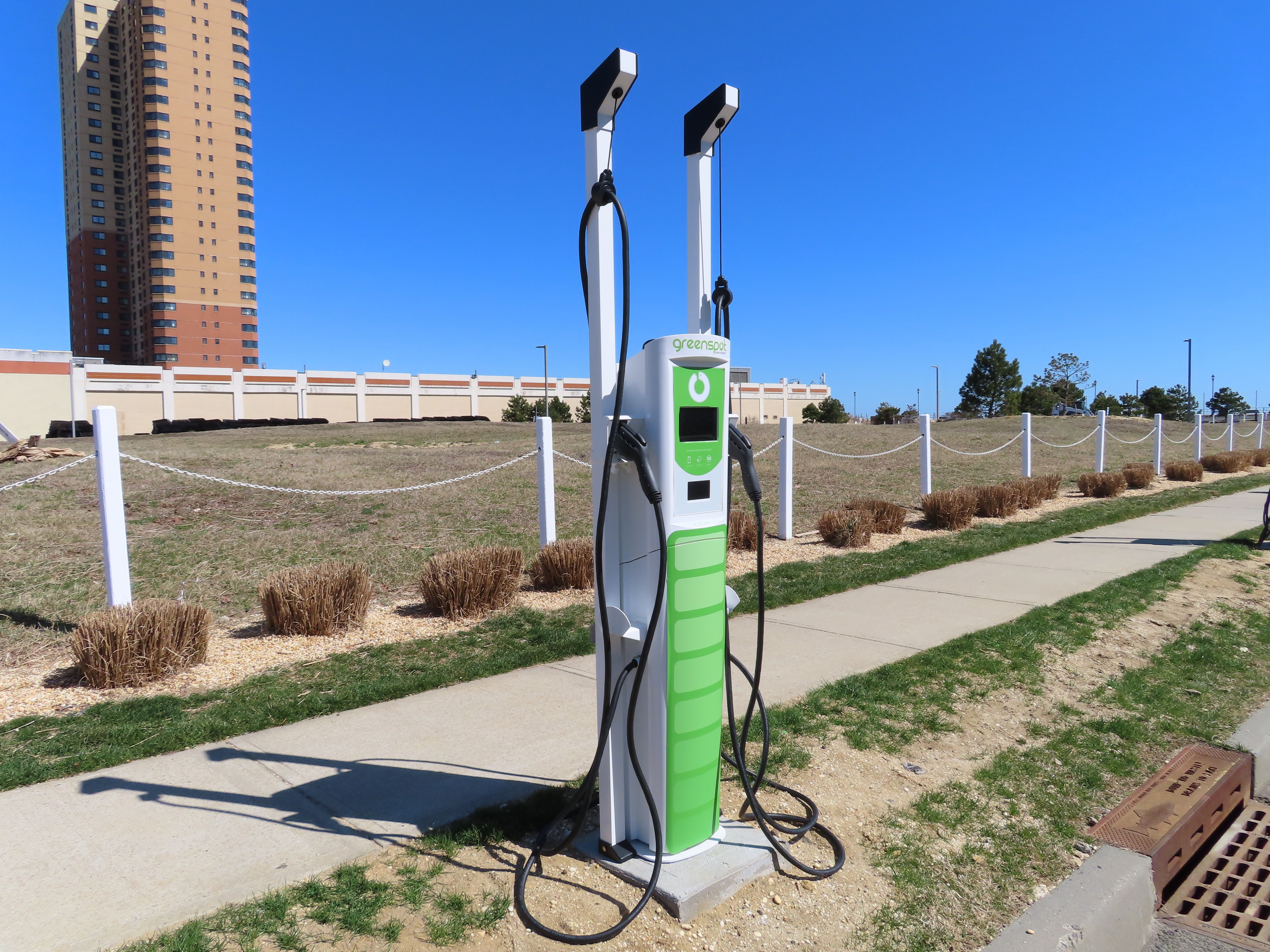 An electric vehicle charging station is pictured on Monday in Asbury Park, N.J. Communities across the U.S. are adding such stations in an effort that began well before gasoline prices surged this year.