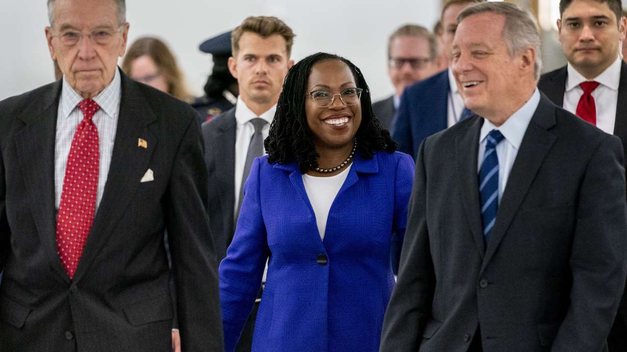 Supreme Court nominee Ketanji Brown Jackson, center, accompanied by ranking member Sen. Chuck Grassley, R-Iowa, left, and Chairman Sen. Dick Durbin, D-Ill., second from right, arrives for her Senate Judiciary Committee confirmation hearing on Capitol Hill in Washington, Monday.